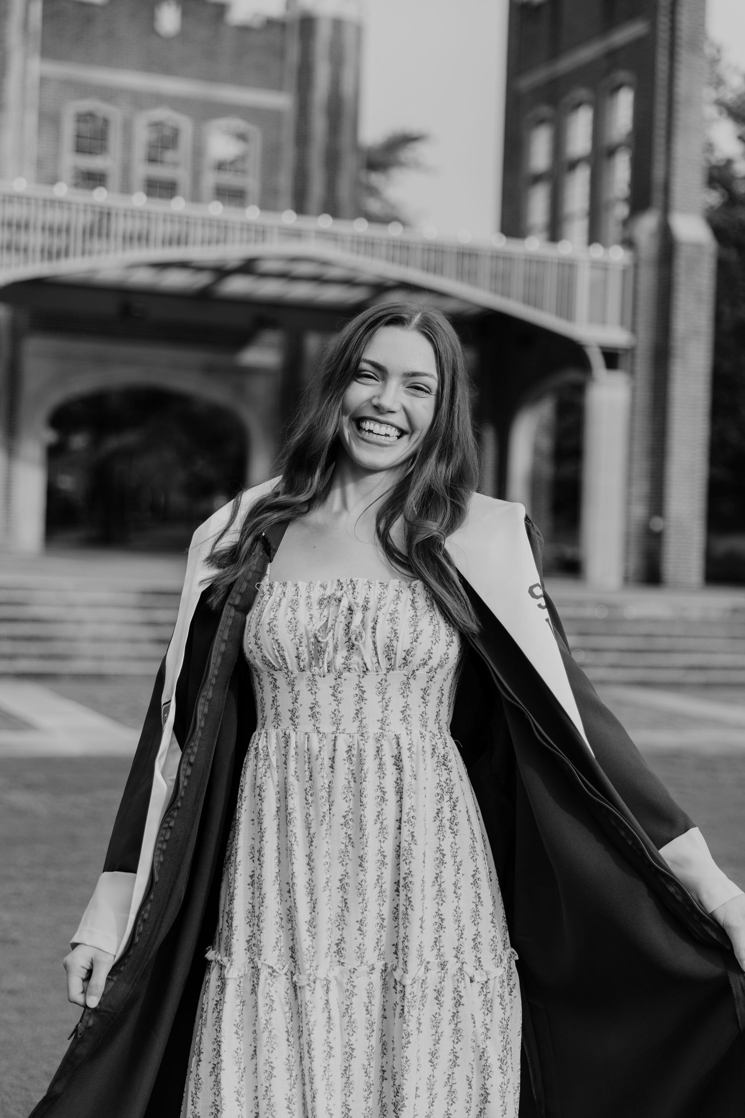 Black and white graduation photos featuring decorative stole and dress.