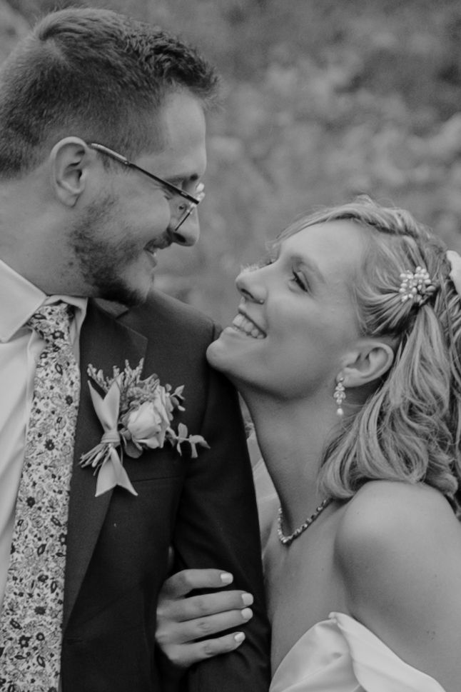 Intimate black and white close-up of bride and groom showing tender romantic moments.