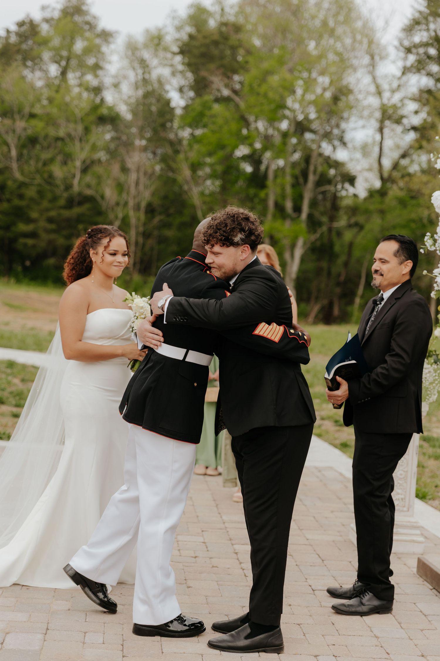 Fun wedding party dance sequence showing playful choreographed moves on stone patio.