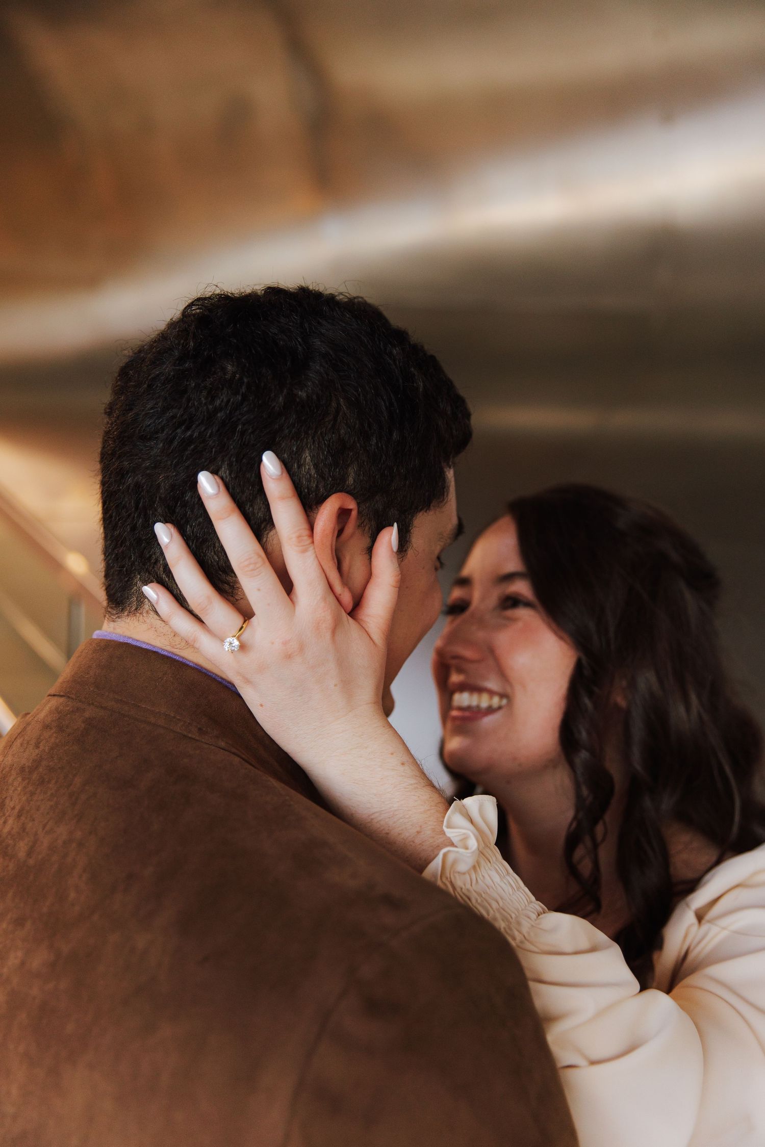 Close-up sequence of a tender romantic moment between a couple in warm lighting.