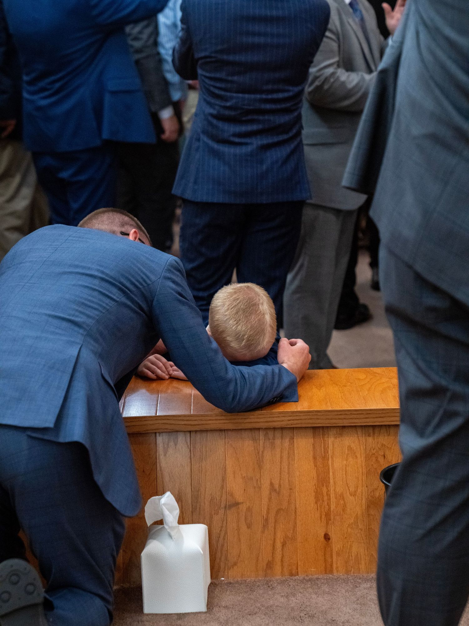 Man praying at church altar during worship service