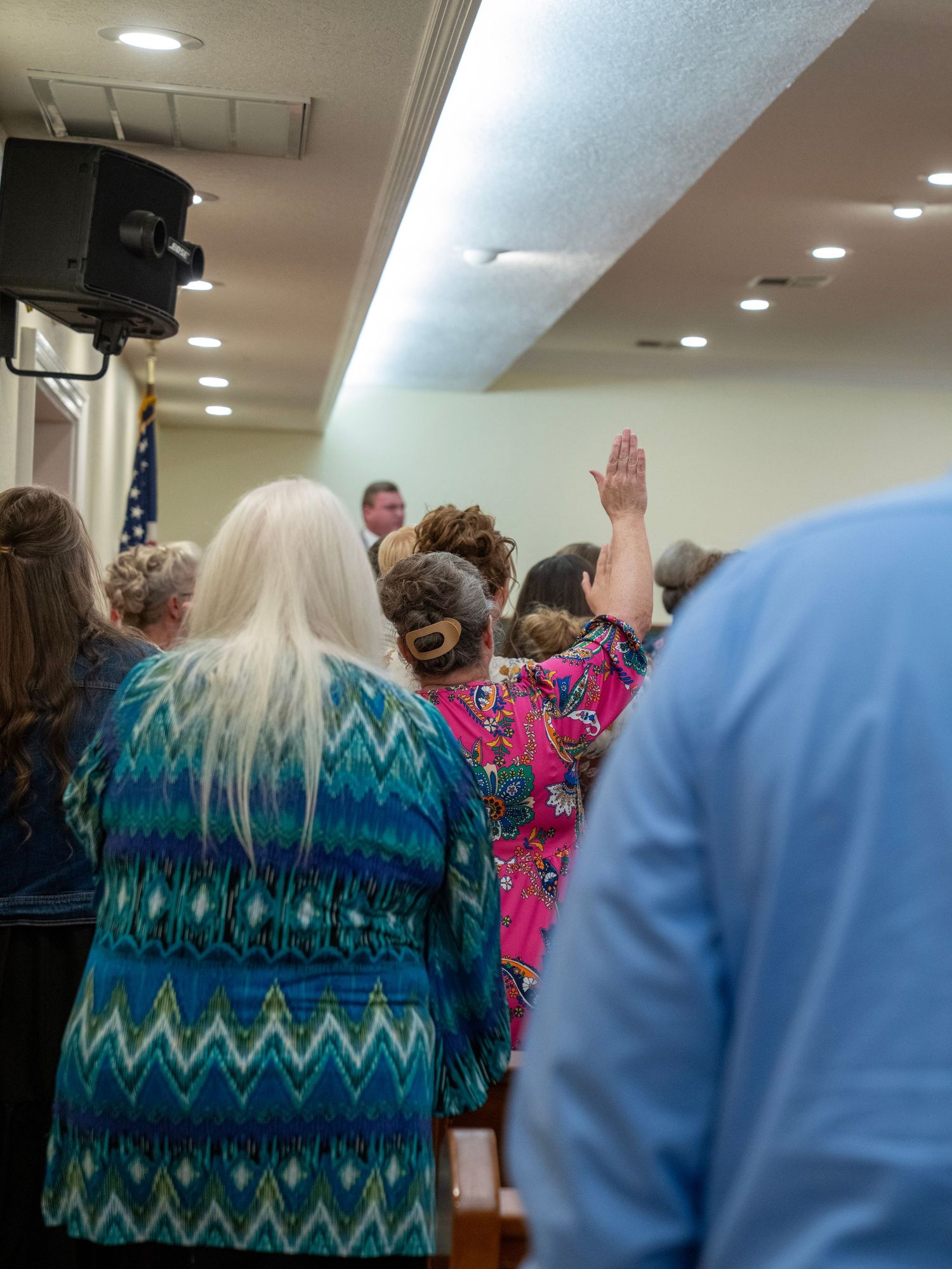 Congregation worshipping during church service