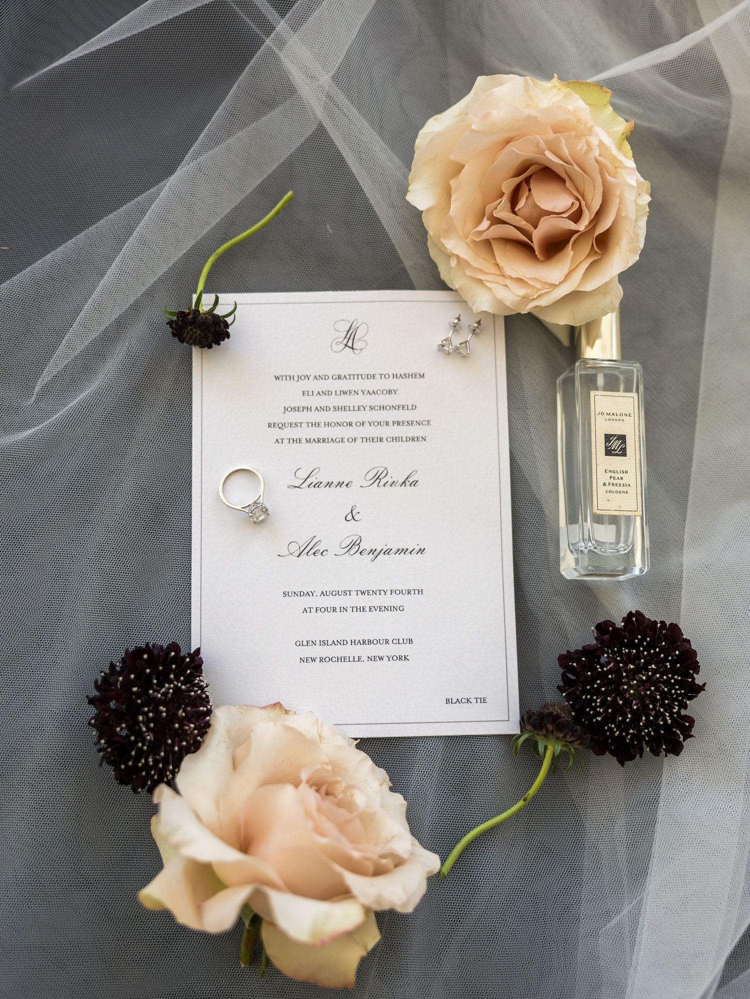 Wedding invitation for Lianne Richa and Alex Benjamin with roses and diamond ring in Glen Island New York City.