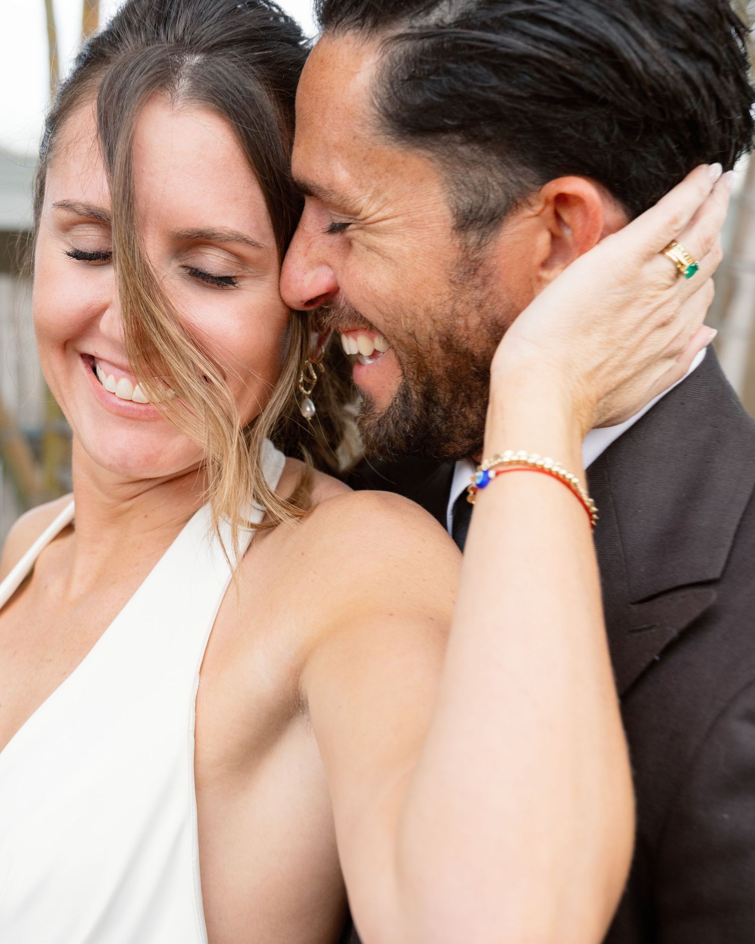 A romantic close-up moment between a couple sharing laughter and intimacy.