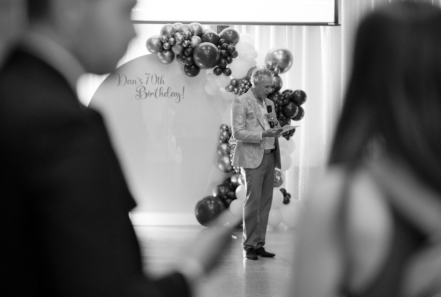 A series of black and white wedding photographs showing candid moments during a romantic ceremony.