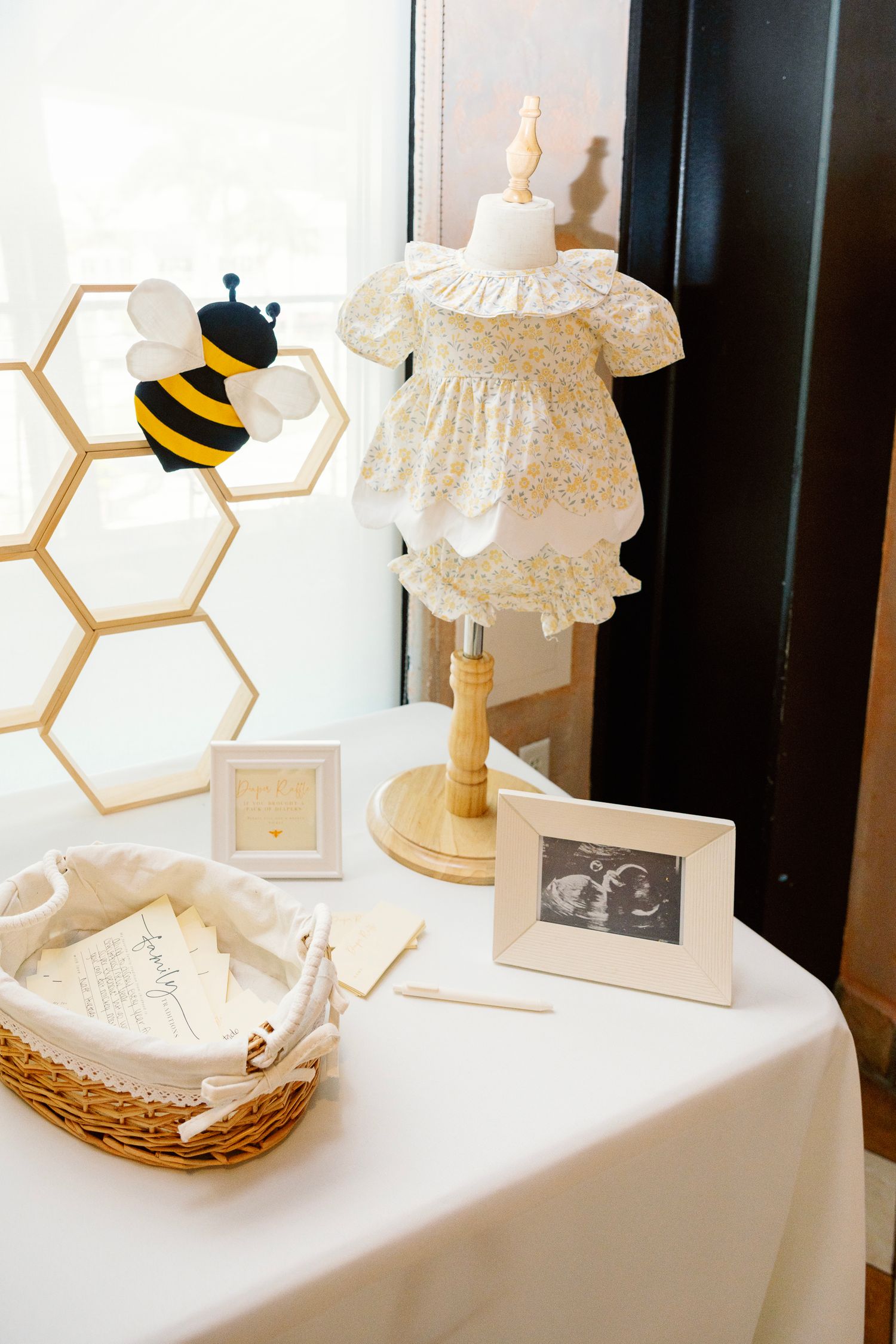 White table display with honeycomb decorative elements and delicate lace details.