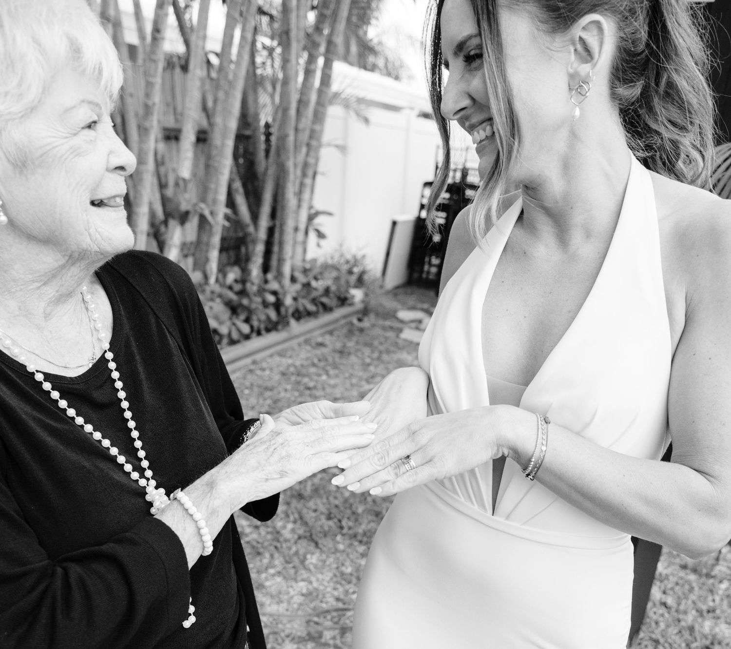Black and white candid wedding party photos showing emotional reactions and interactions.
