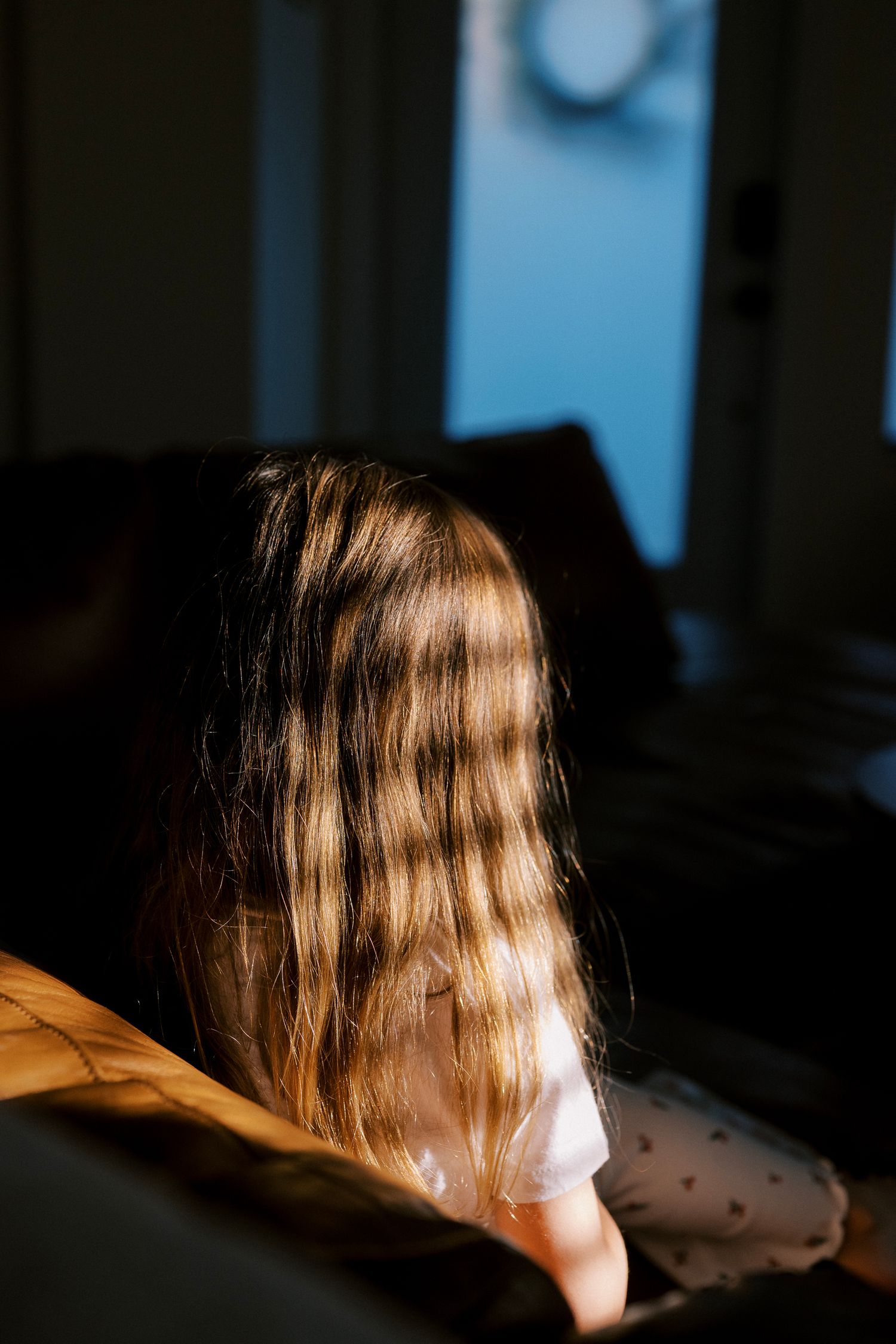 Artistic sequence of a woman's hair illuminated by natural light through a window creating a dreamy atmosphere.