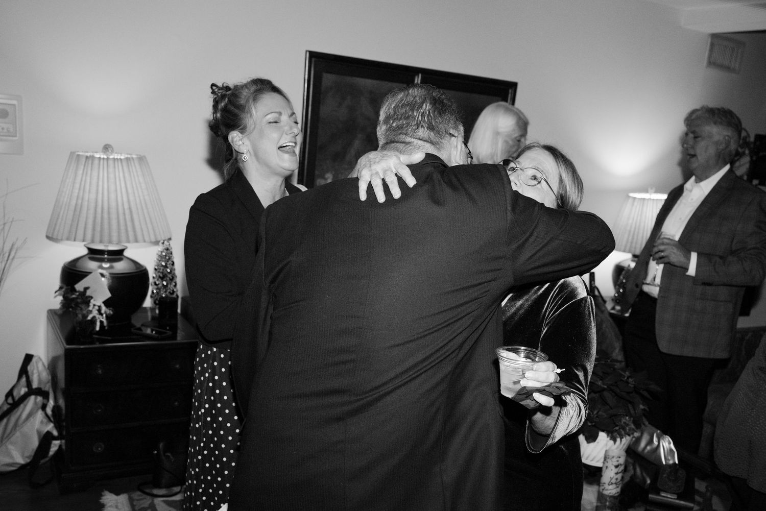 A series of black and white photos showing people dancing and socializing at what appears to be a party or celebration.