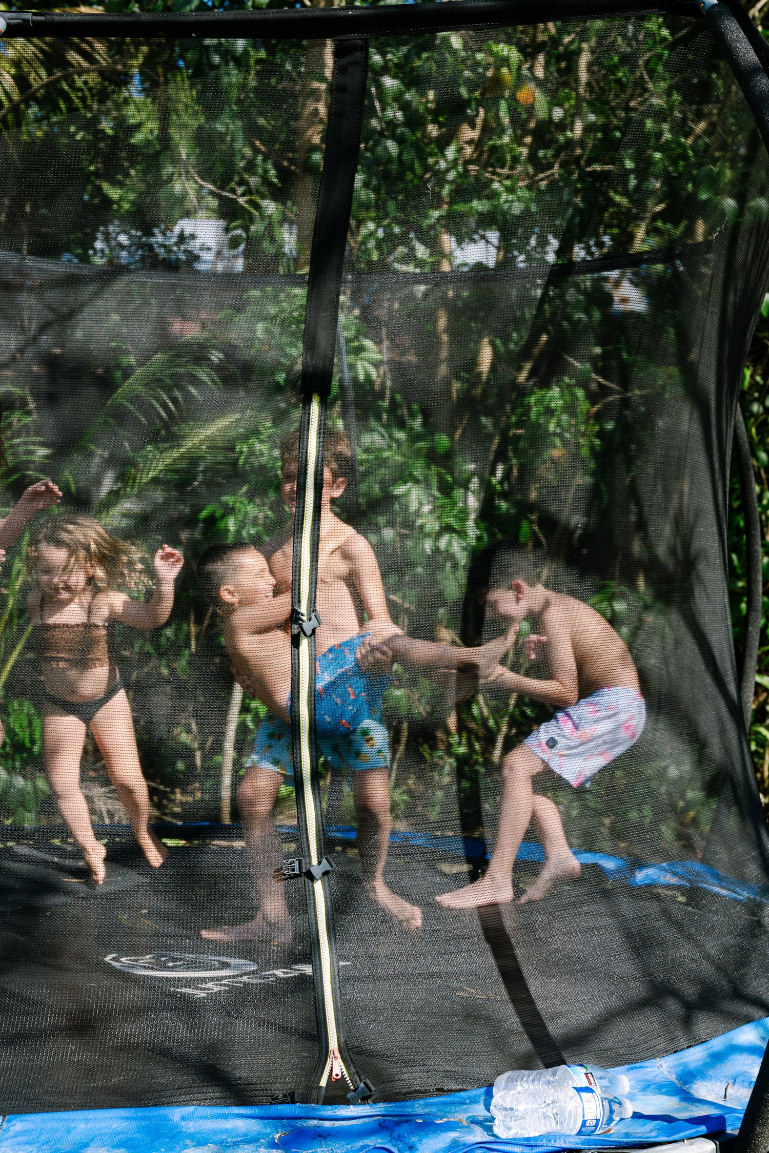 A sequence of trampoline bouncing movements captured in multiple frames showing athletic motion and technique.