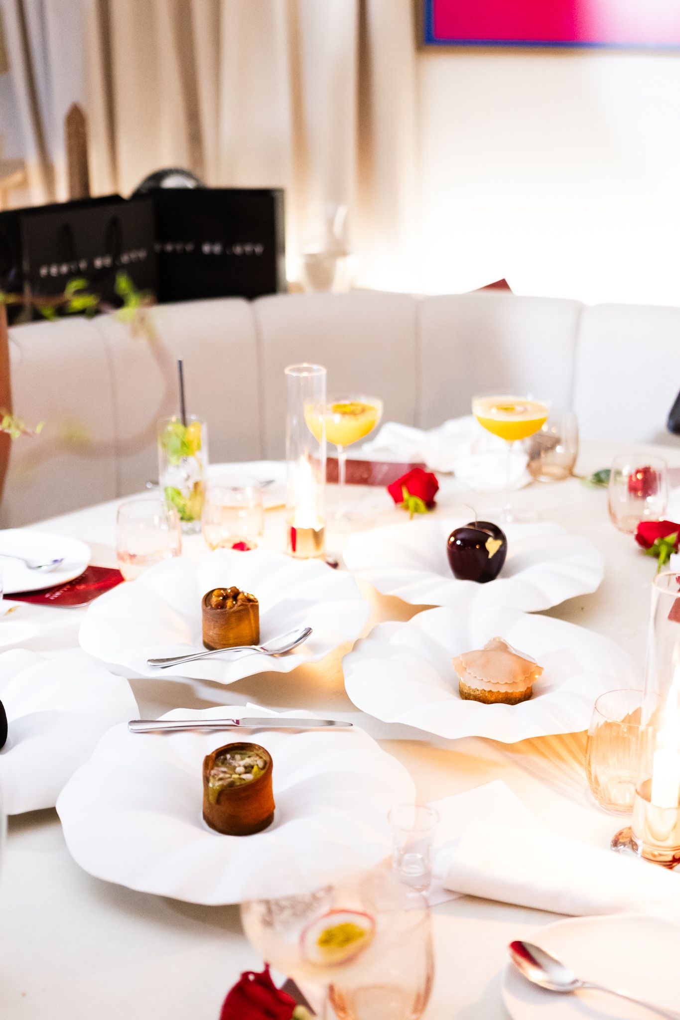 Intimate dinner event photography for Romy in collaboration with Fenty Beauty, elegant table setting with guests, Paris — by Nineevision
