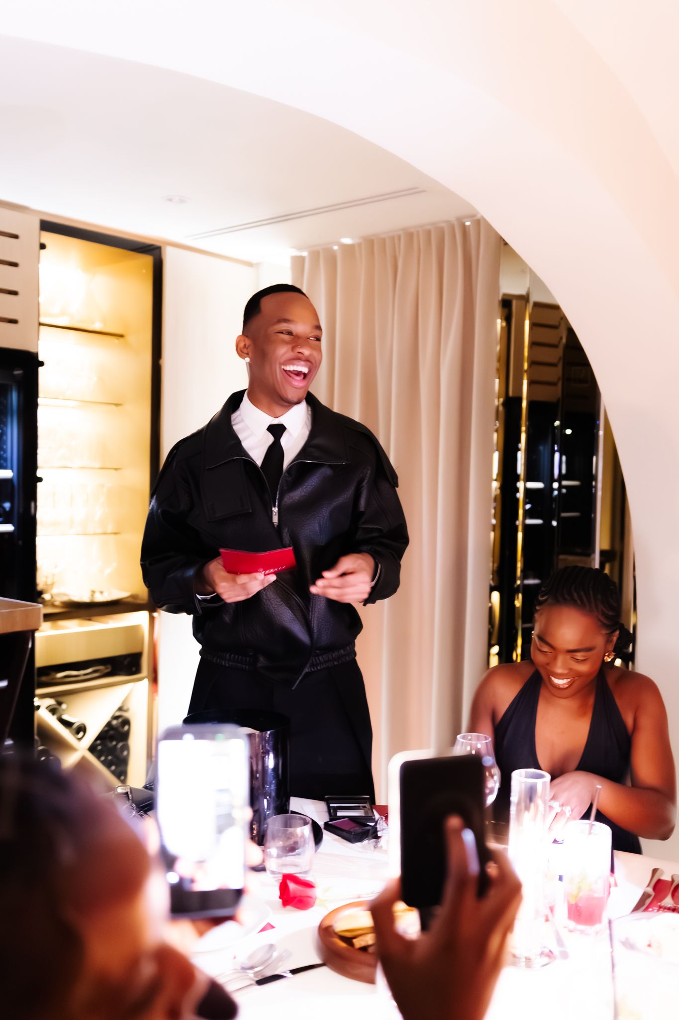 Intimate dinner event photography for Romy in collaboration with Fenty Beauty, elegant table setting with guests, Paris — by Nineevision