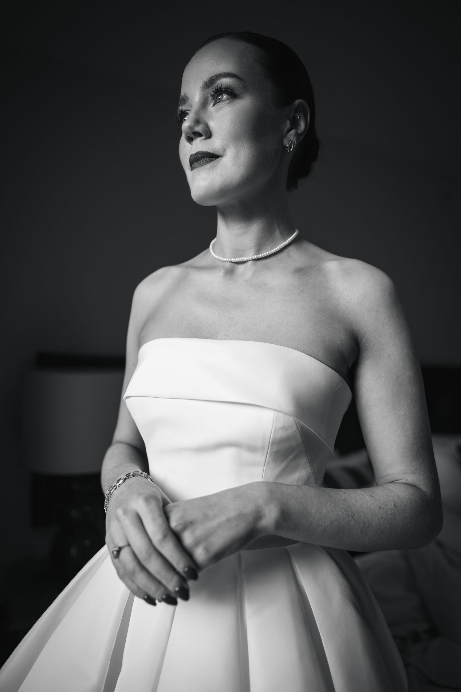 Portrait of Elegant bride in strapless ballgown with pearl necklace at Bellinter House wedding in Co. Meath.