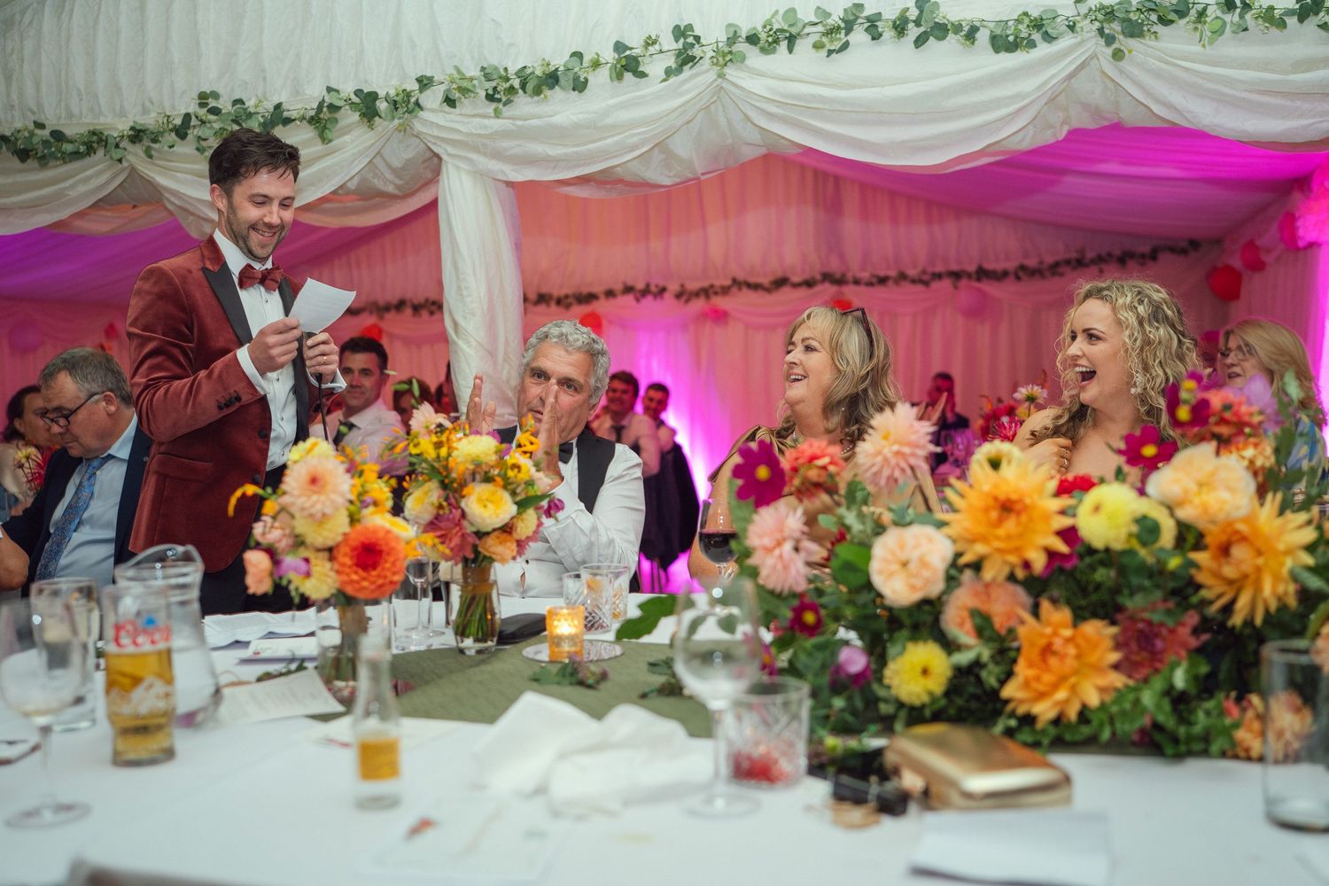 A groom giving a speech at a wedding reception table outdoor garden wedding reception in Co Meath.