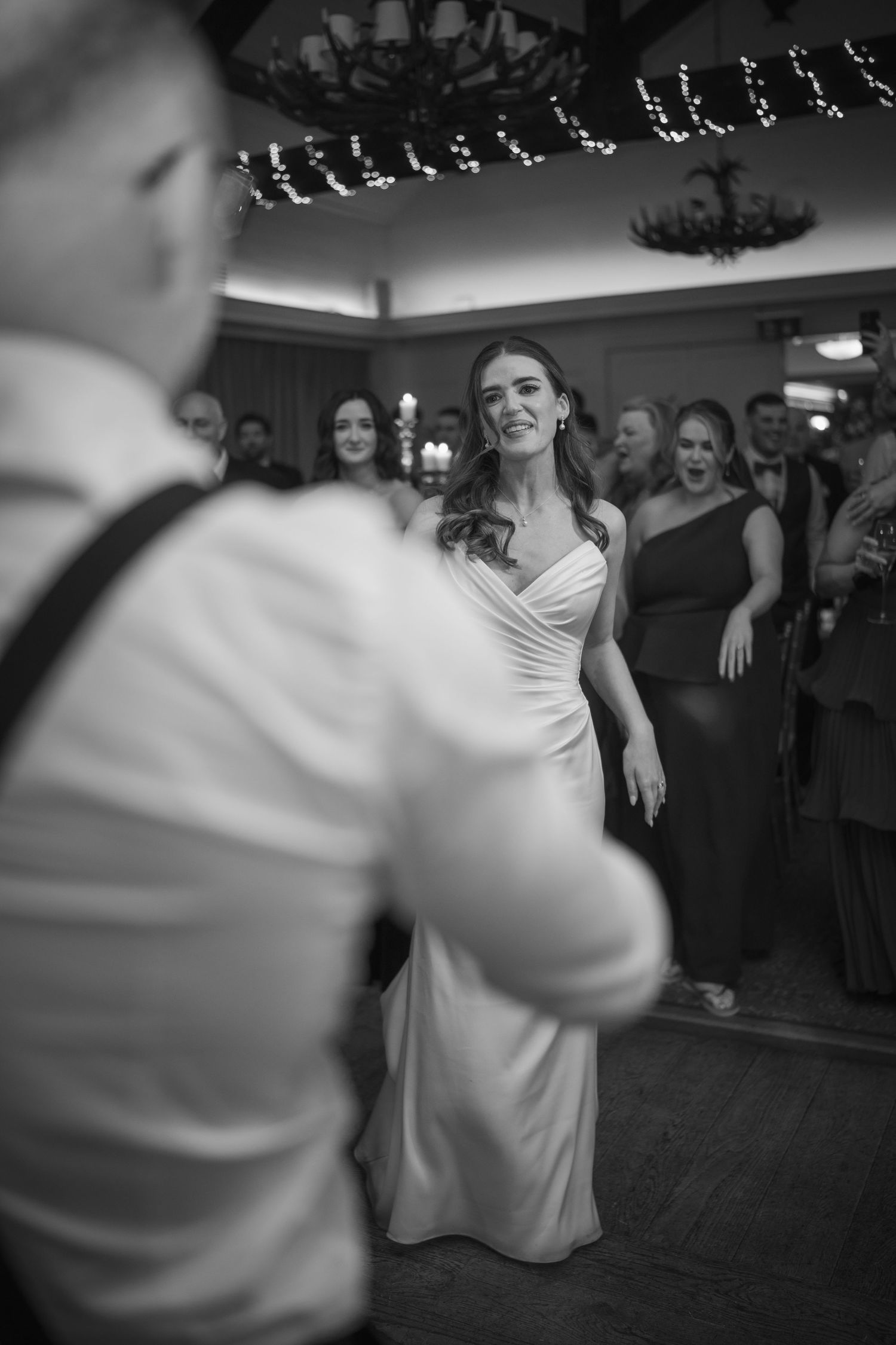 Photo of bride in white gown smiling at partner during wedding first dance at Mount Juliet wedding in Kilkenny.