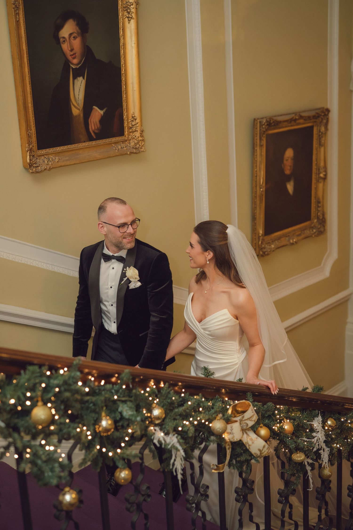 Bride and groom share a romantic moment on a grand staircase at the Manor House Mount Juliet wedding Kilkenny.