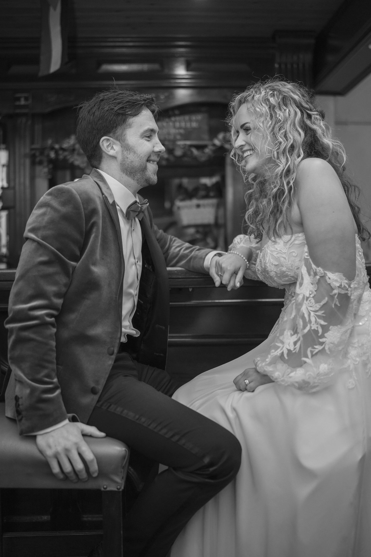 Bride and groom sharing a joyful moment together outdoor garden wedding reception in Co Meath.
