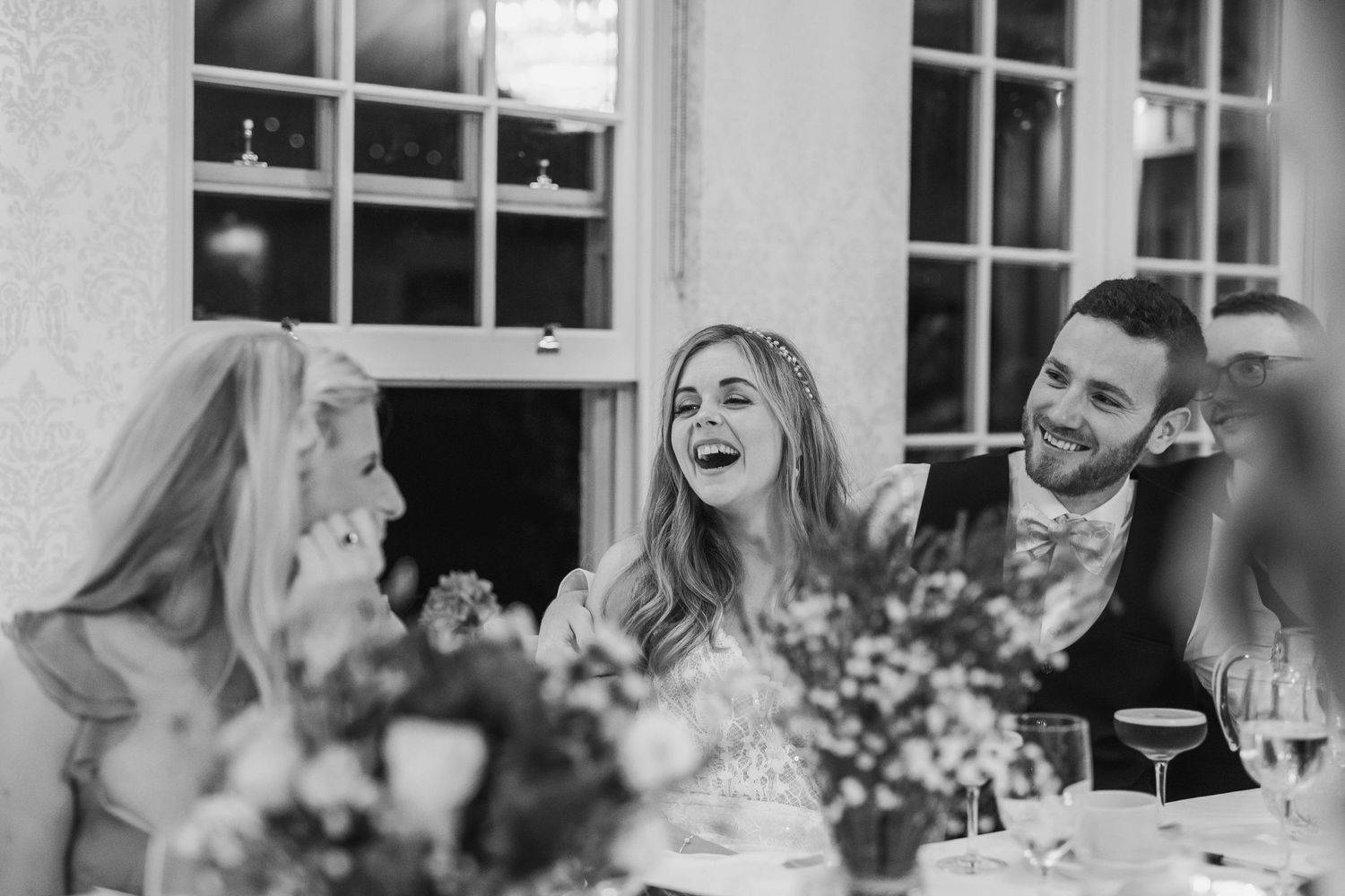Bride laughs joyfully with groom at at Rathsallagh House wedding in Wicklow