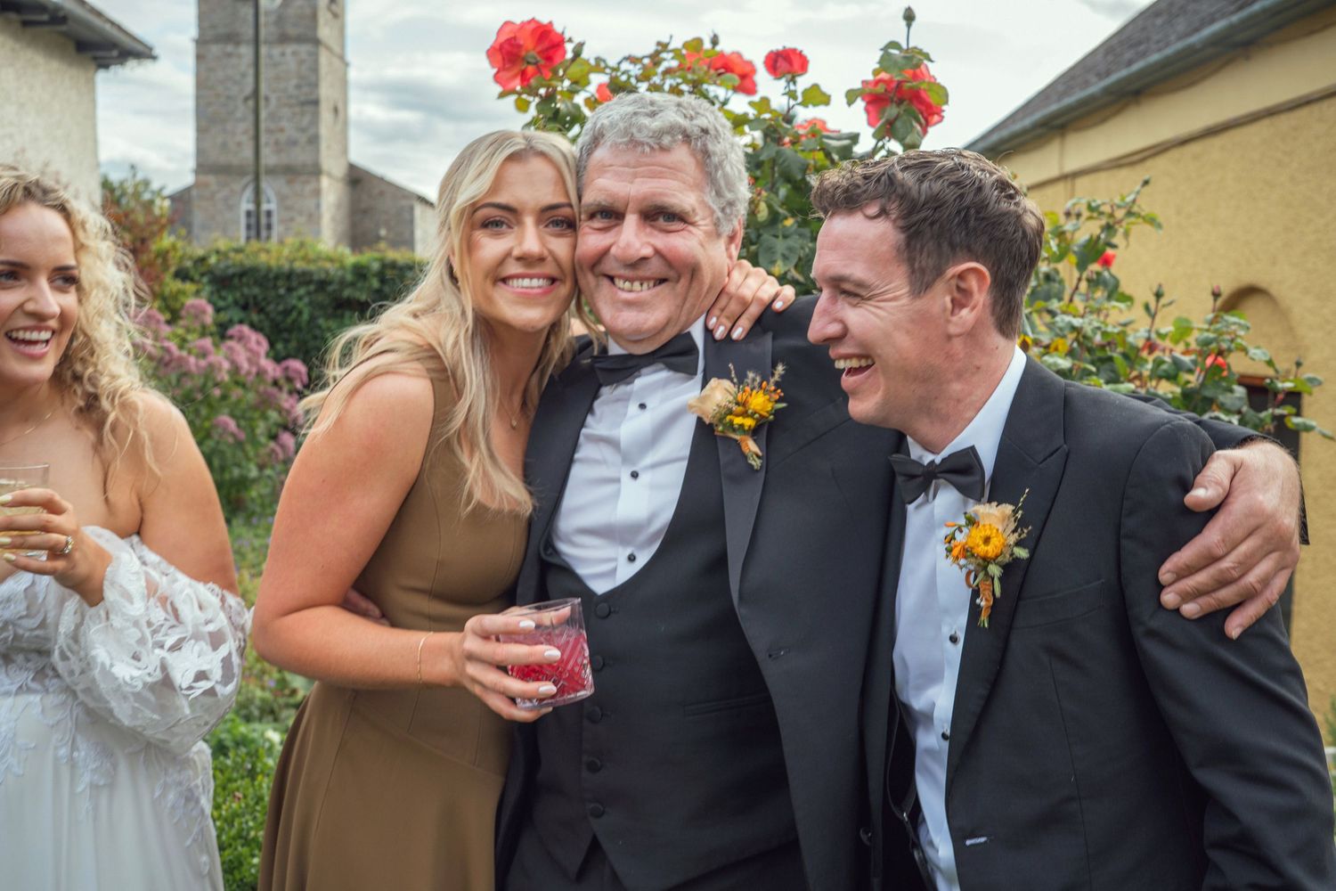 Joyful wedding guests at garden outdoor garden wedding reception in Co Meath.