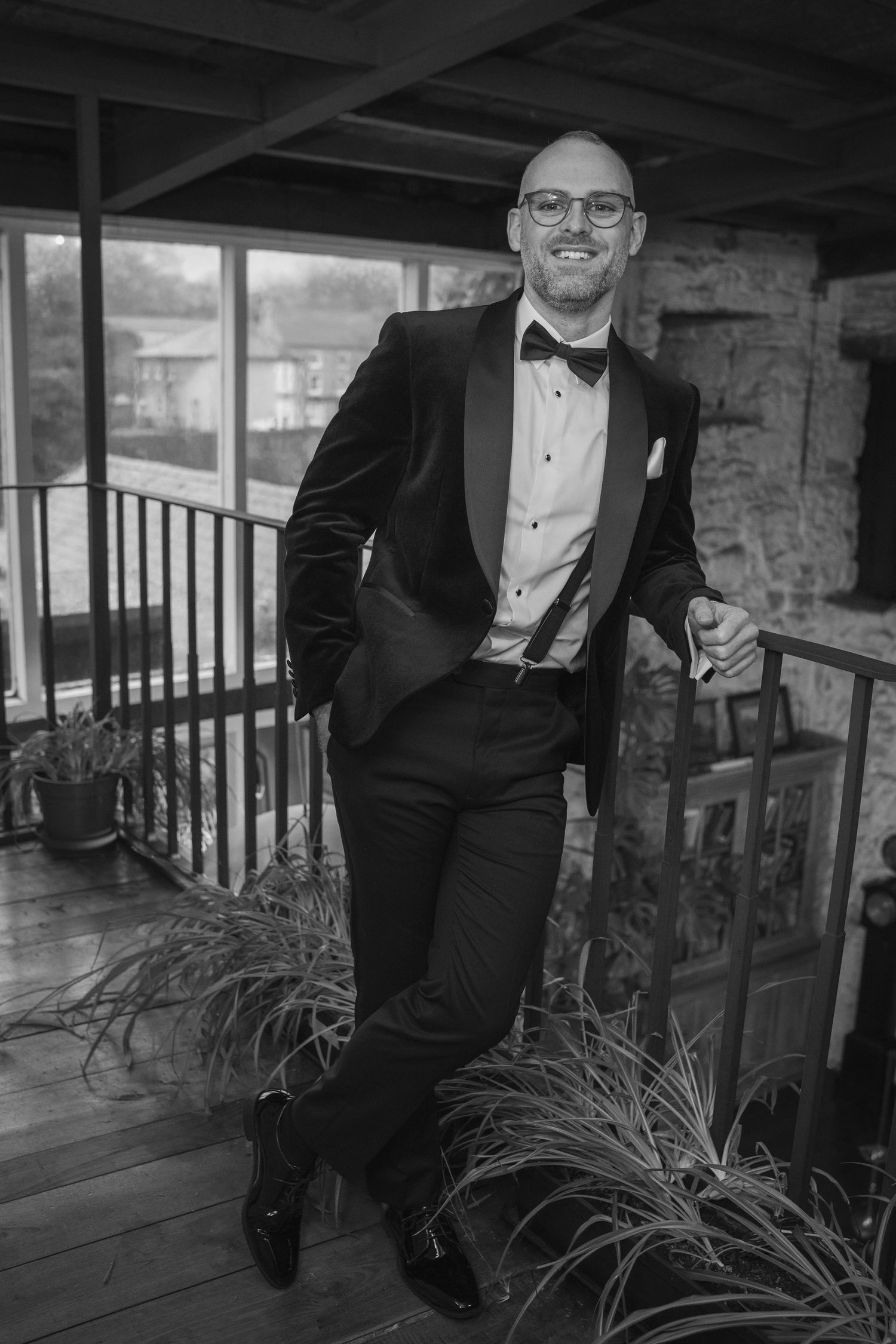Smiling groom in black tuxedo and bow tie at the Manor House Mount Juliet wedding Kilkenny.