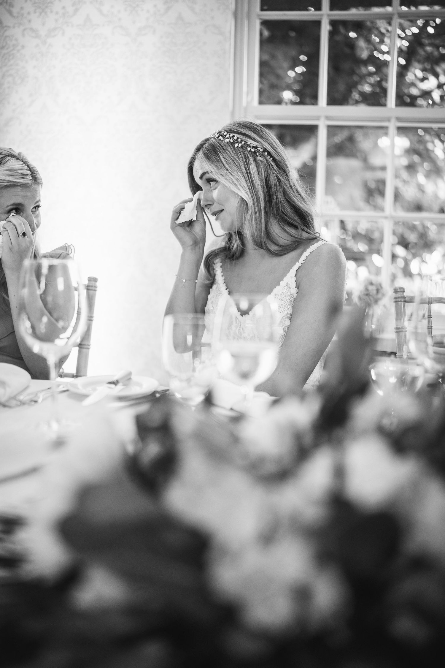 Emotional bride wiping tears at wedding reception at Rathsallagh House wedding in Wicklow