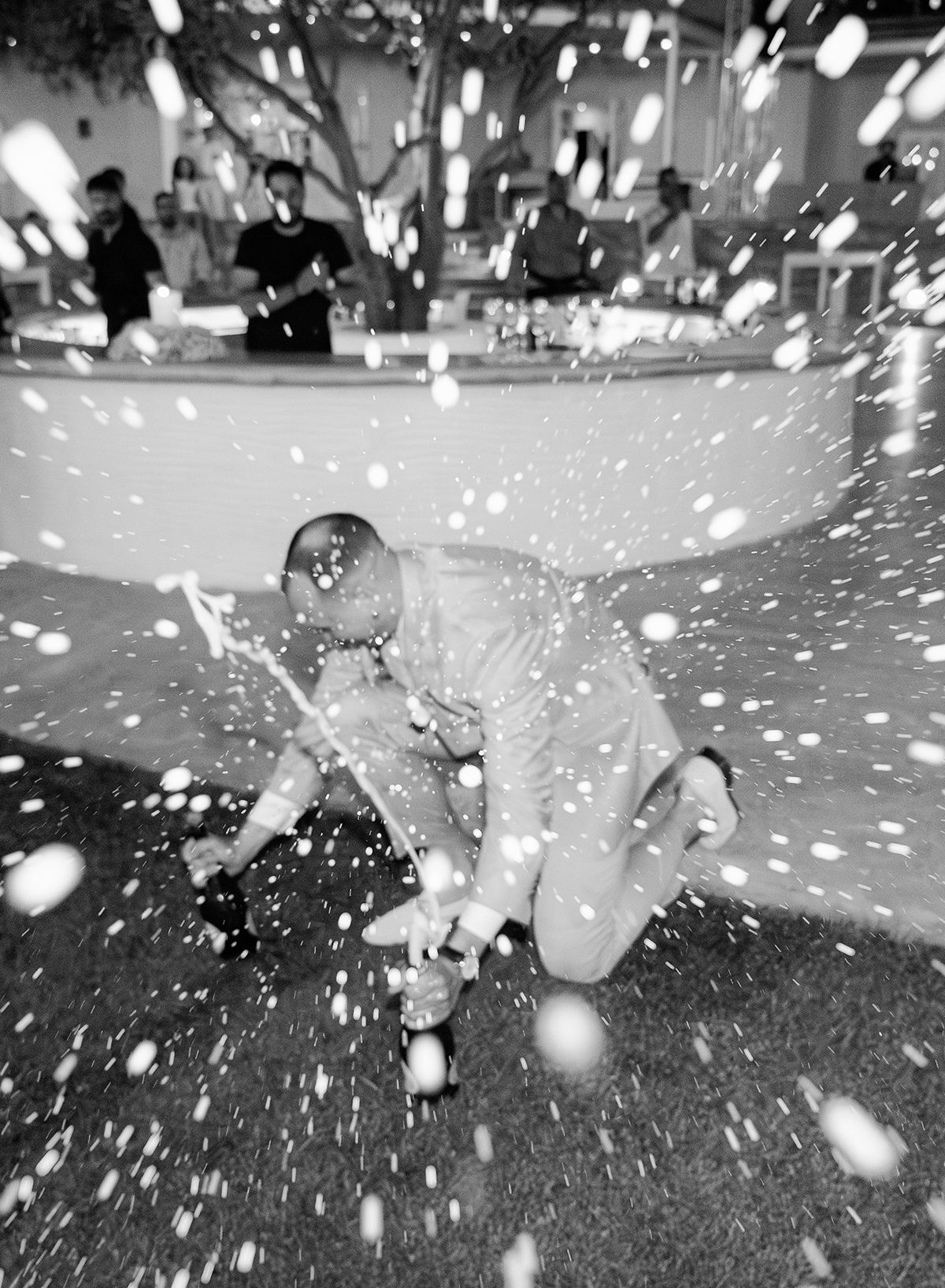 Joyful wedding celebration moment captured by Refined White