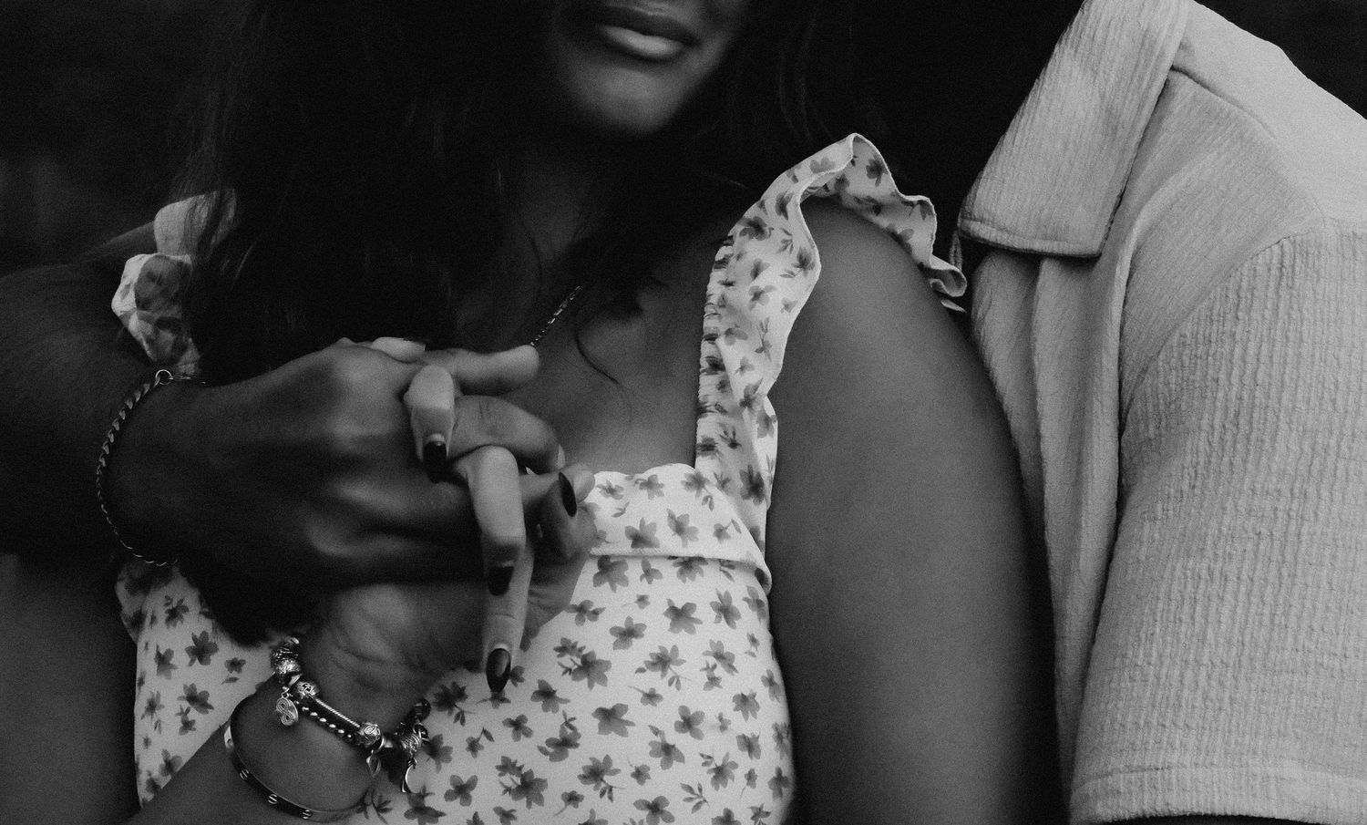 A romantic black and white photo sequence showing a couple embracing and sharing tender moments together.