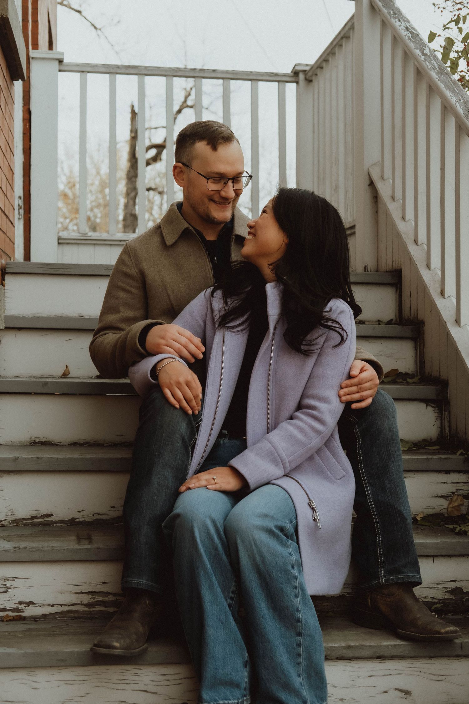 A couple sits intimately on wooden porch steps in a series of candid romantic moments.