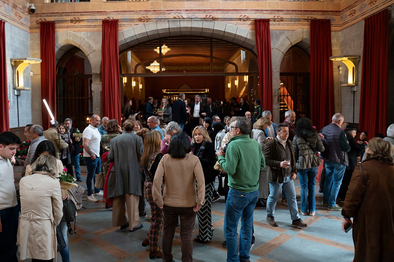Crowd of visitors gathered in ornate venue lobby during La Granja en Flor spring event.