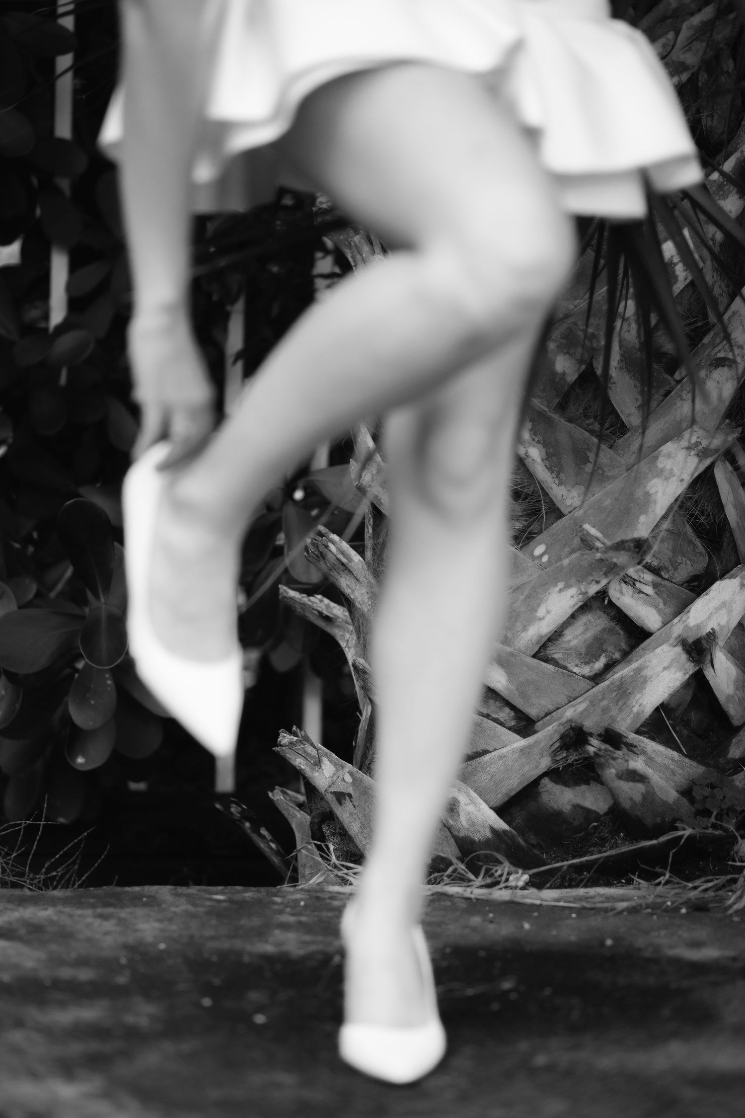 Bride fixing her heels in Miami