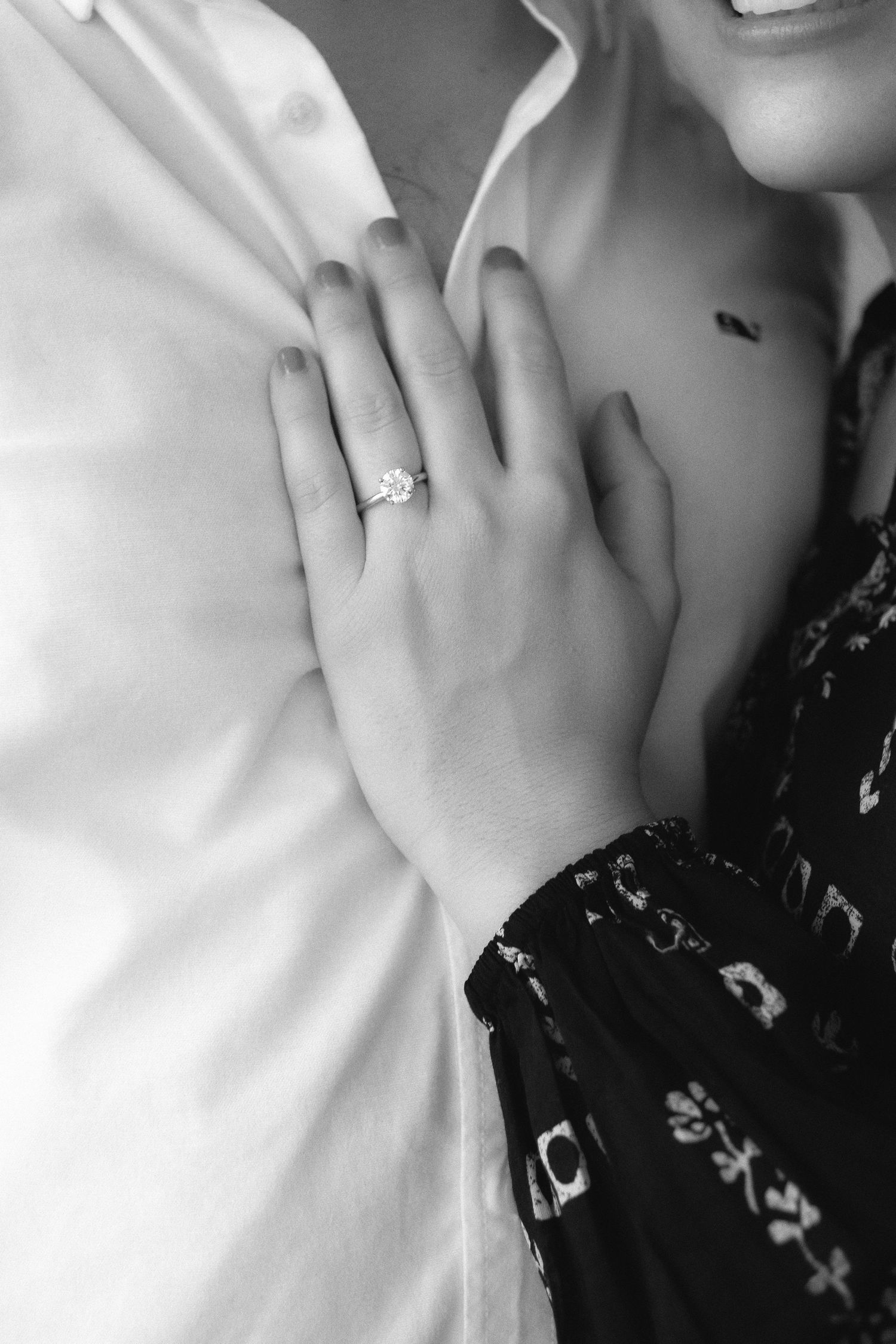 Newlywed engaged couple showing engagement ring after proposal at Crandon Park, Miami