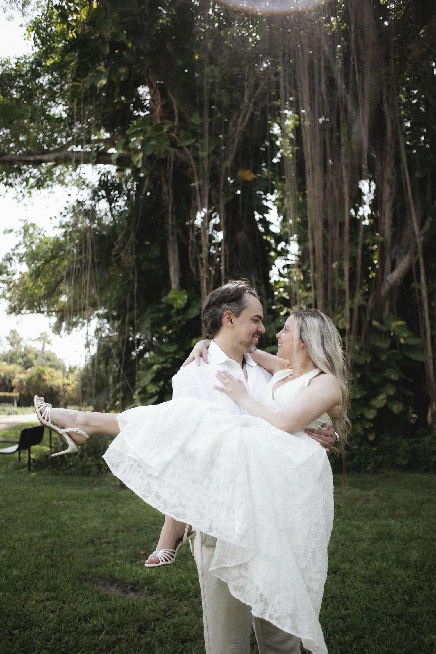 Newlywed engaged couple embracing after proposal in The Ancient Spanish Monastery, Miami Beach