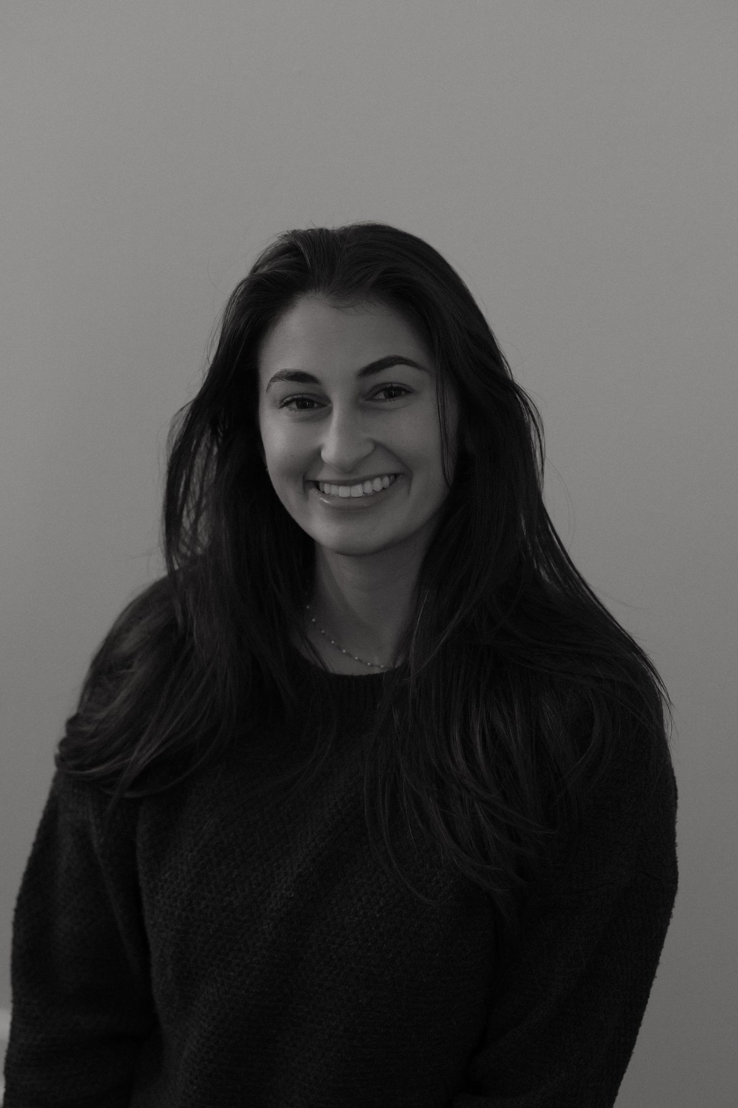 Woman smiling, black and white photo