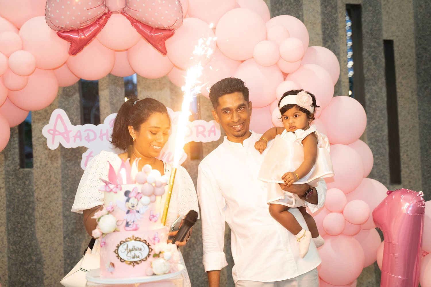 Pink balloon arch decorations create a festive party atmosphere.