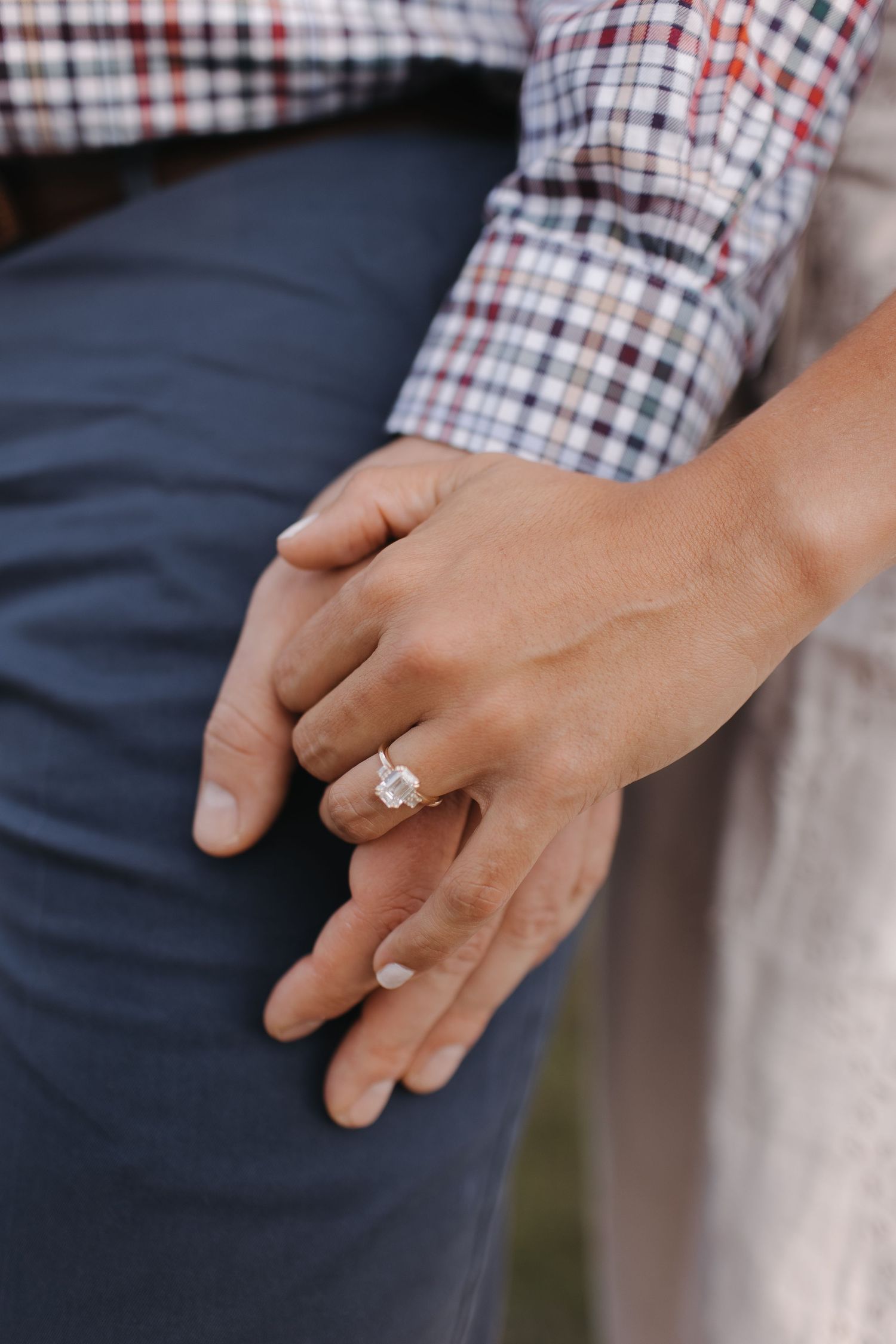 Close-up sequence showing hands with an engagement ring in natural lighting.