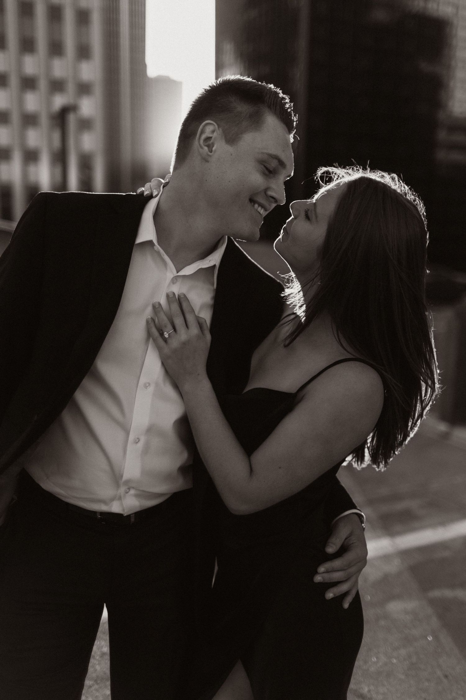 Intimate black and white photo sequence showing tender moments between a couple.