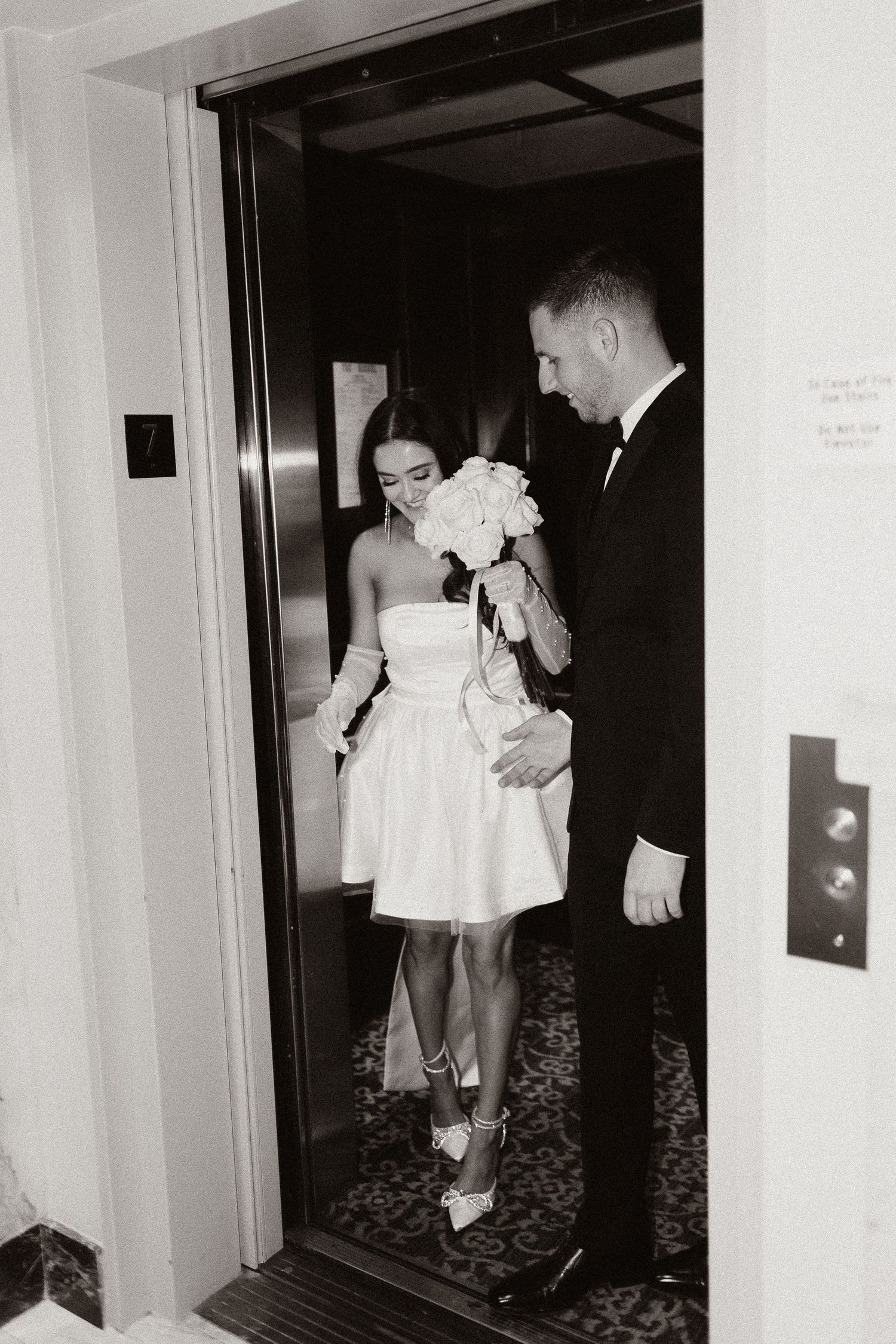 Black and white photos of wedding couple entering and exiting elevator.