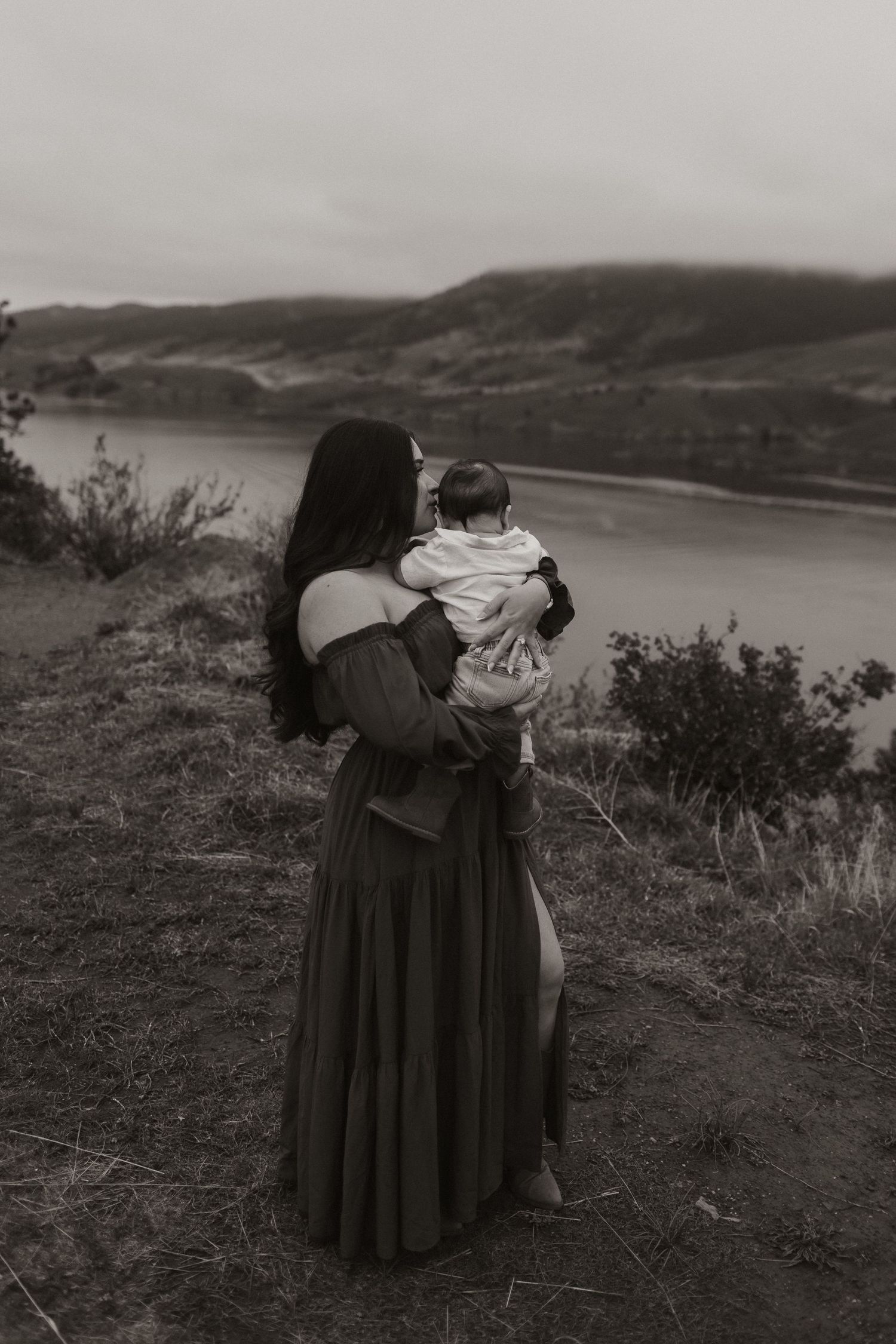 Black and white photos of intimate moments shared against a scenic mountain backdrop.
