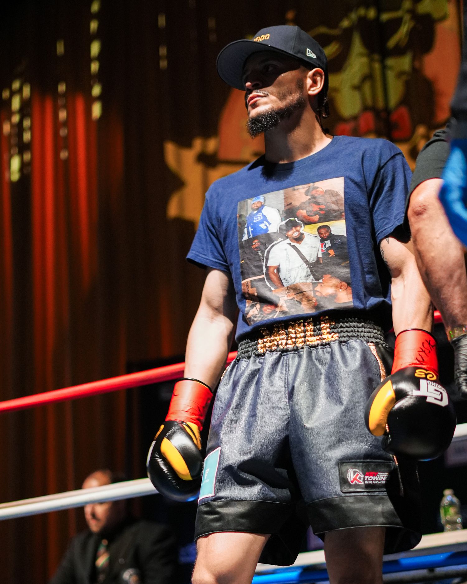 Boxers training in a gym wearing protective gear and boxing gloves.