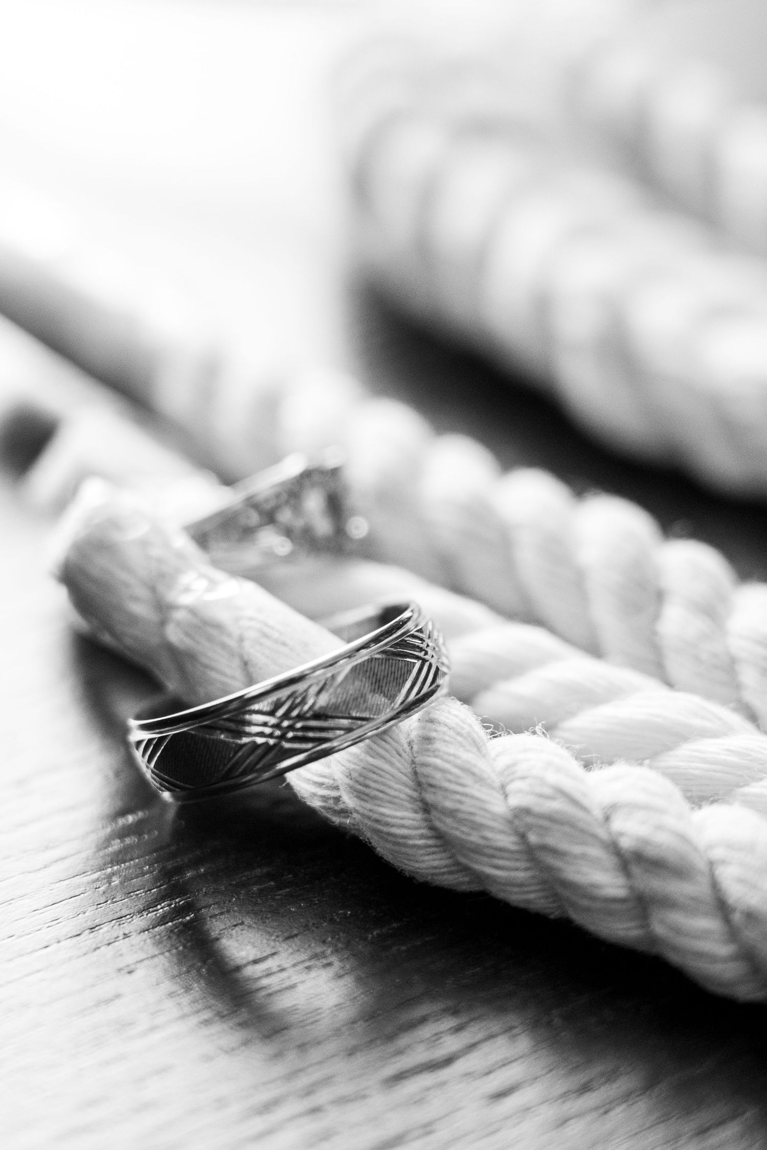 Close-up macro shot of white twisted rope with shallow depth of field.