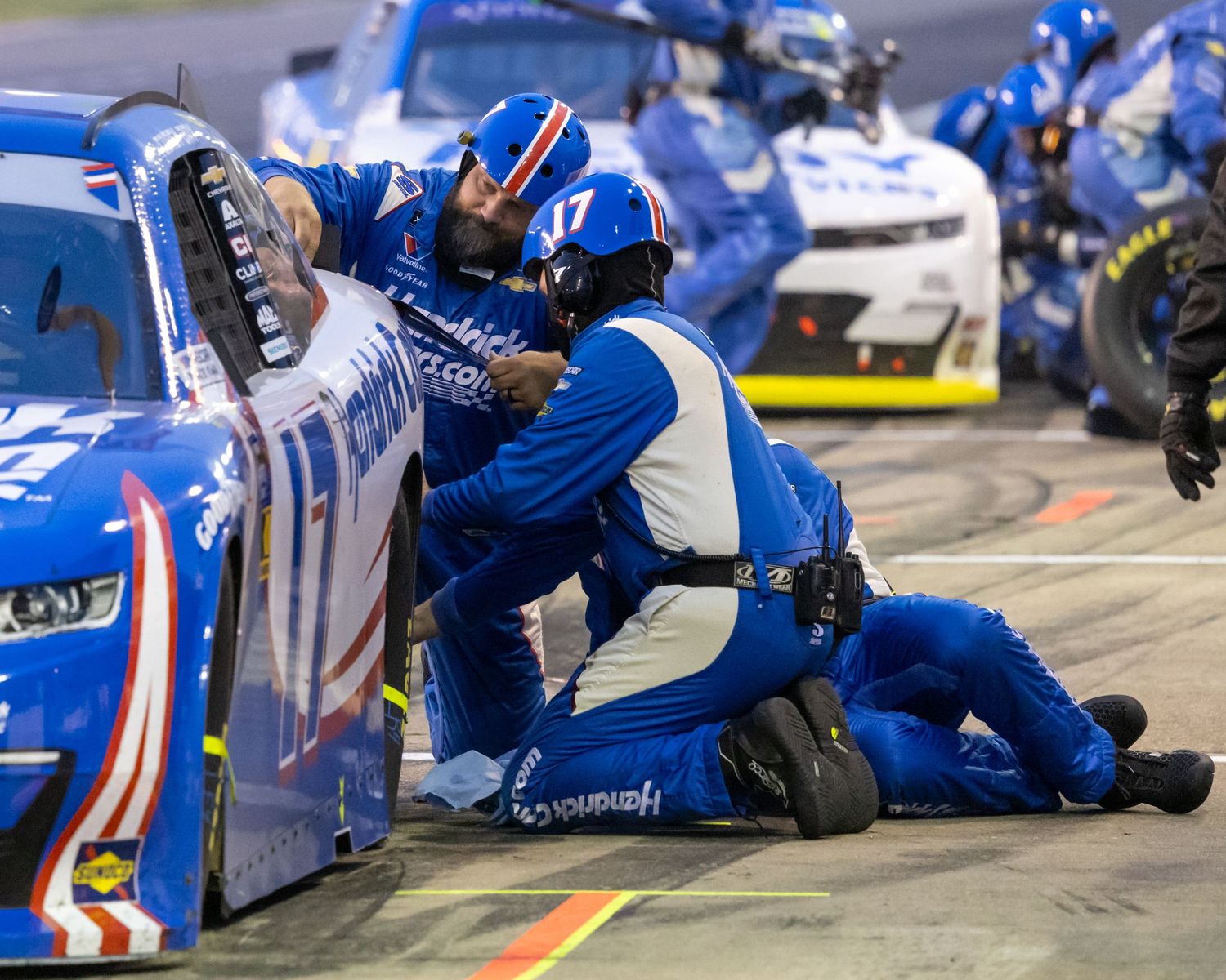 Pit crew working on a car during NASCAR race