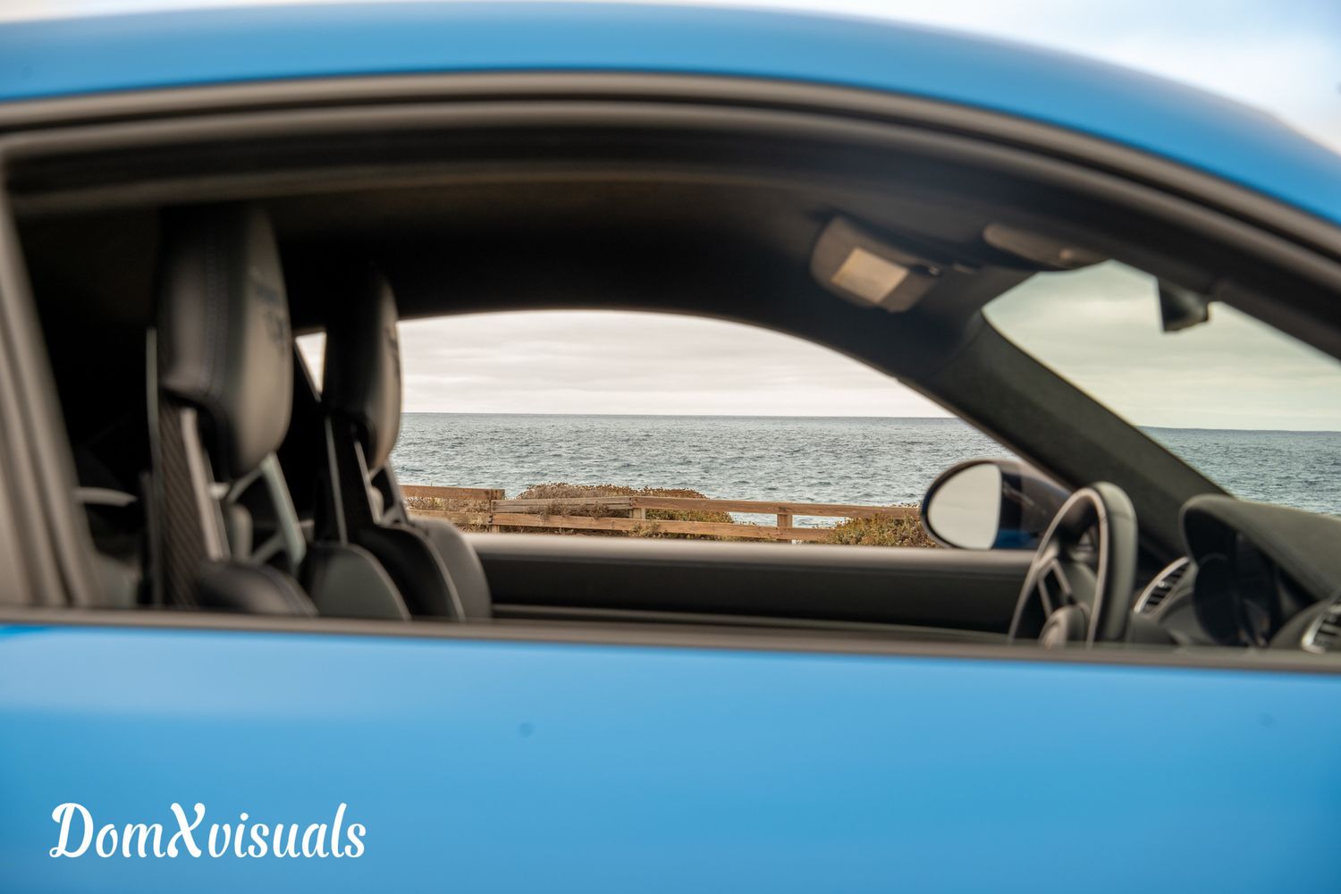 Porsche GT4 RS through the window to the ocean