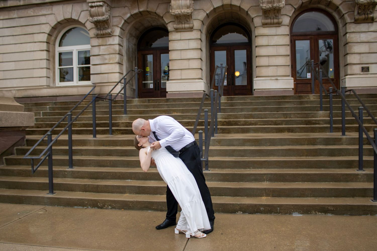 Courthouse wedding, couple sharing a kiss