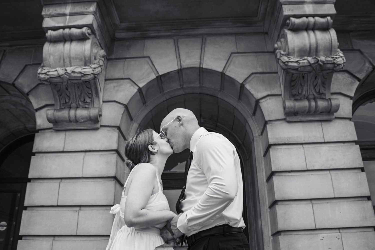 Courthouse wedding, couple sharing a kiss