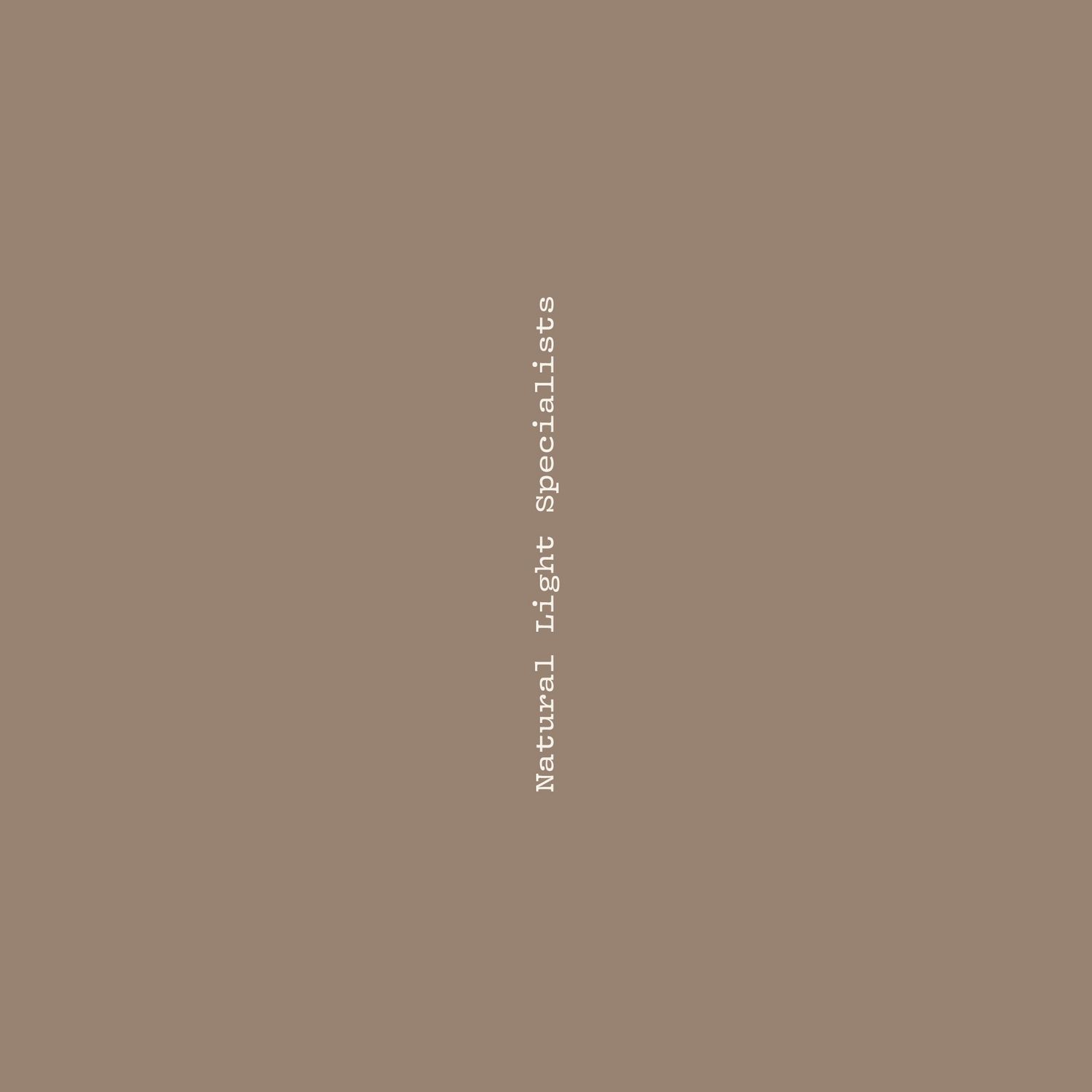 Natural Light Specialists logo text on a warm taupe brown background.