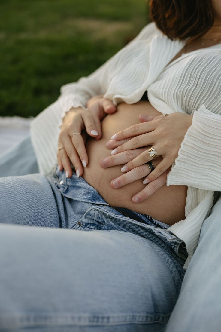 Couple holding baby bump
