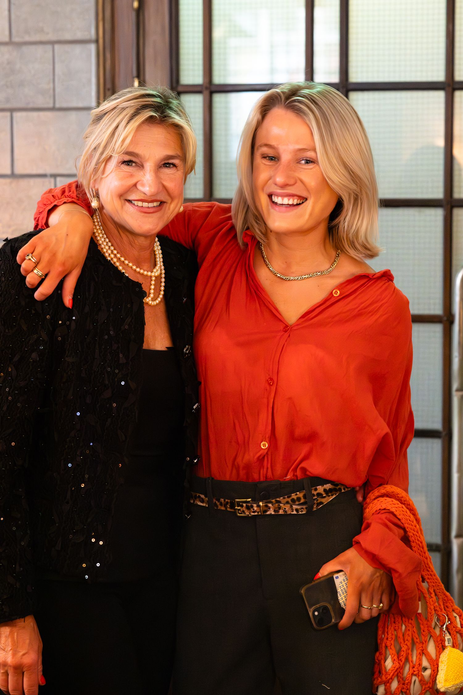 Two people in casual attire laughing and smiling together in a series of candid photos.
