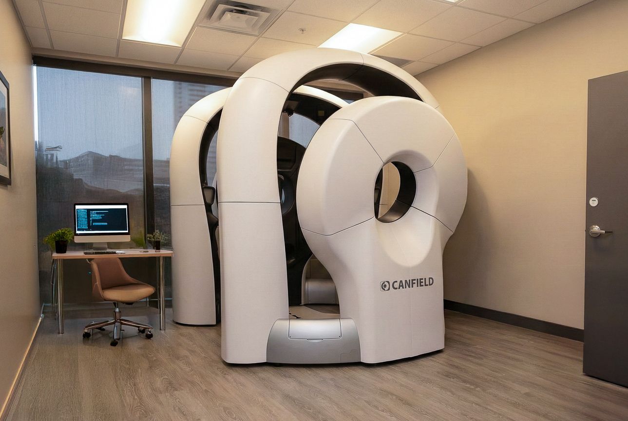 Product Photography Elitra Health full-body imaging scanner in a modern exam room with a desk taken by Guido Venitucci