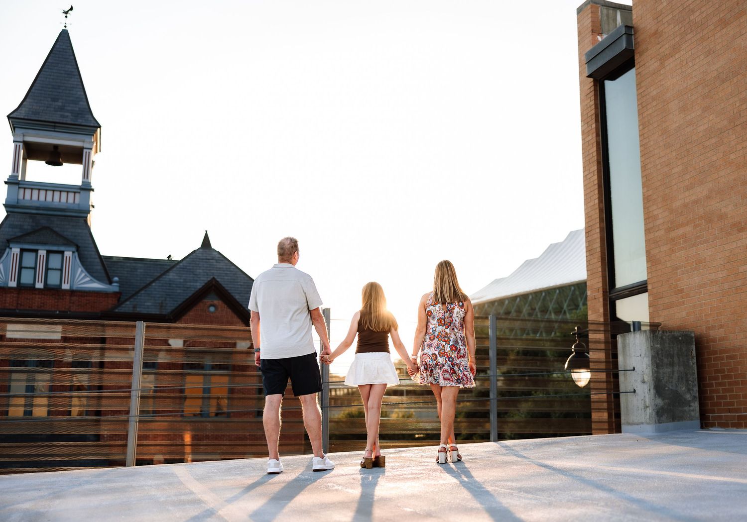 Family photoshoot on a rooftop downtown KC with photographer located throughout the Kansas City Metro area. Based in Blue Springs, Missouri.