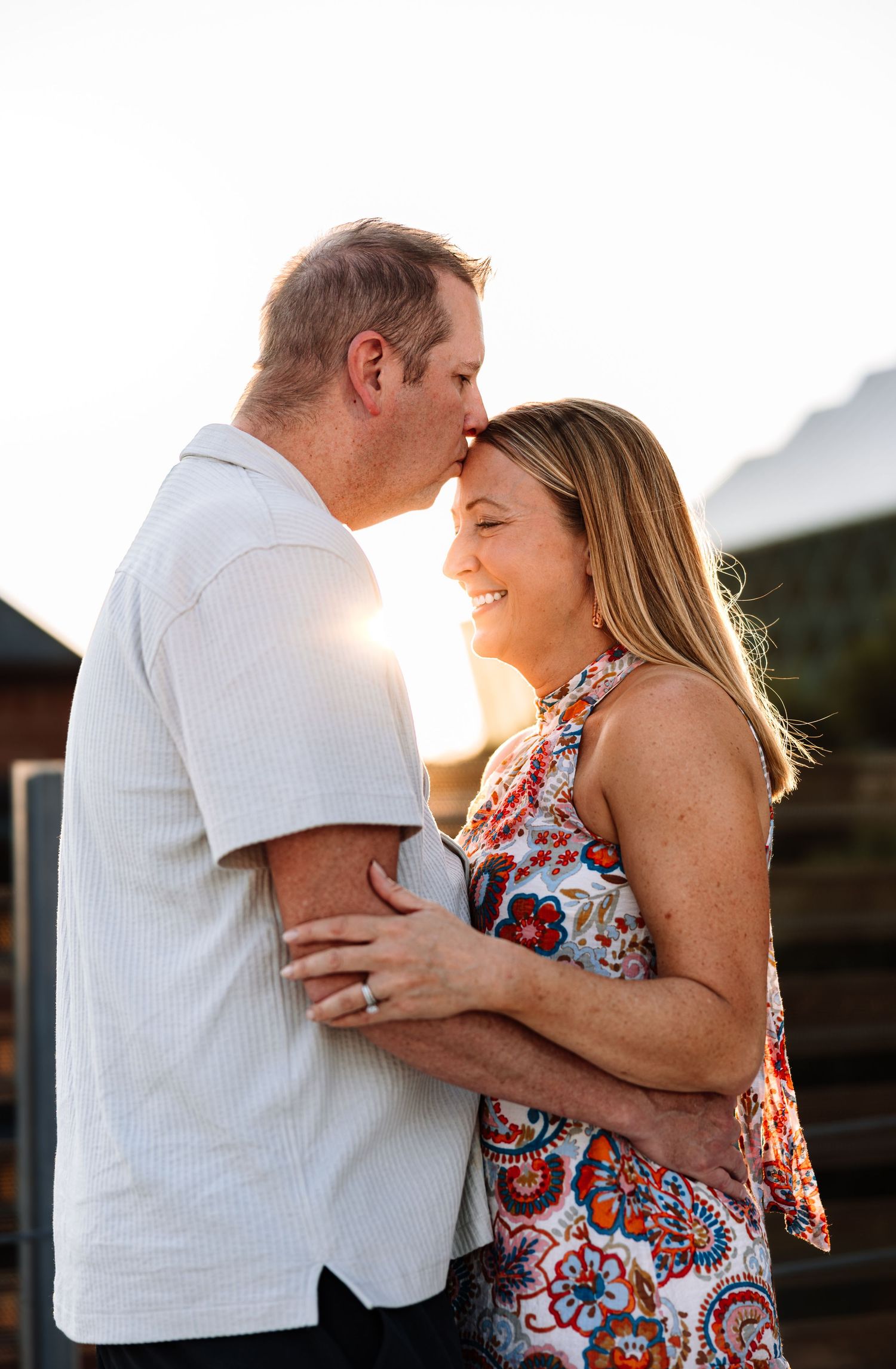 Couple photoshoot on a rooftop downtown KC with photographer located throughout the Kansas City Metro area. Based in Blue Springs, Missouri.